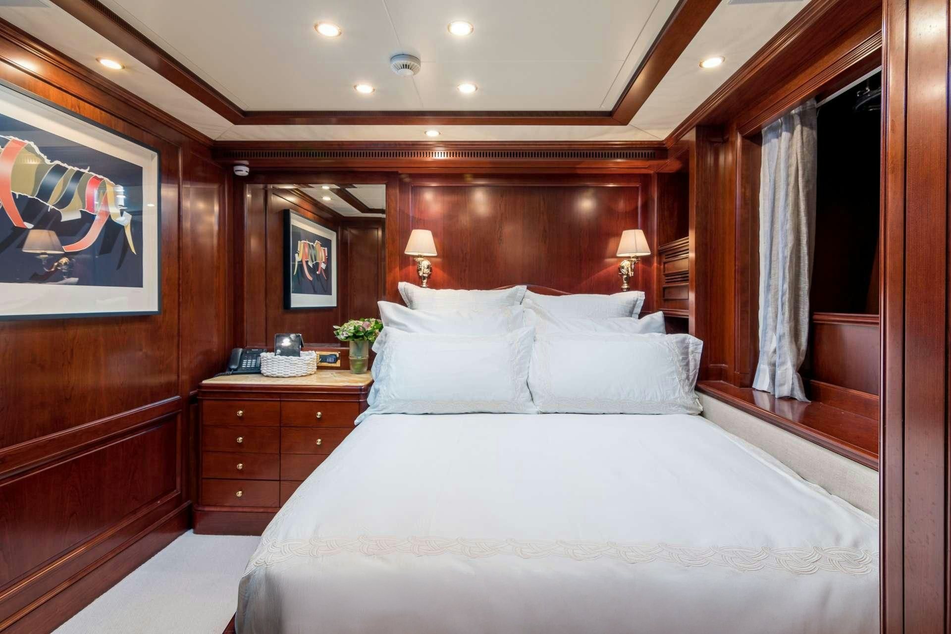 a bed with white sheets aboard ENDLESS SUMMER Yacht for Charter