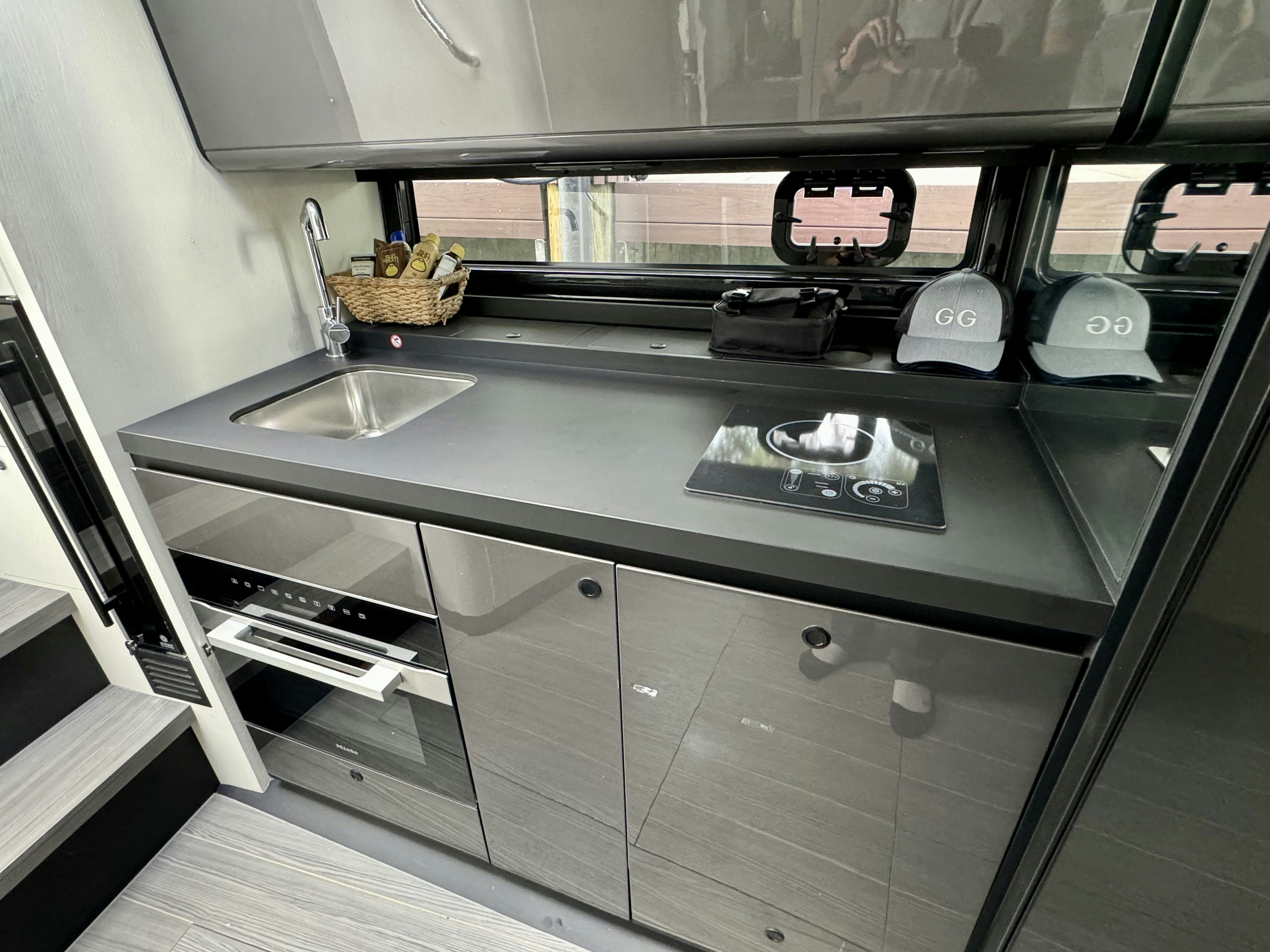 a kitchen with a stove and sink aboard GG Yacht for Sale