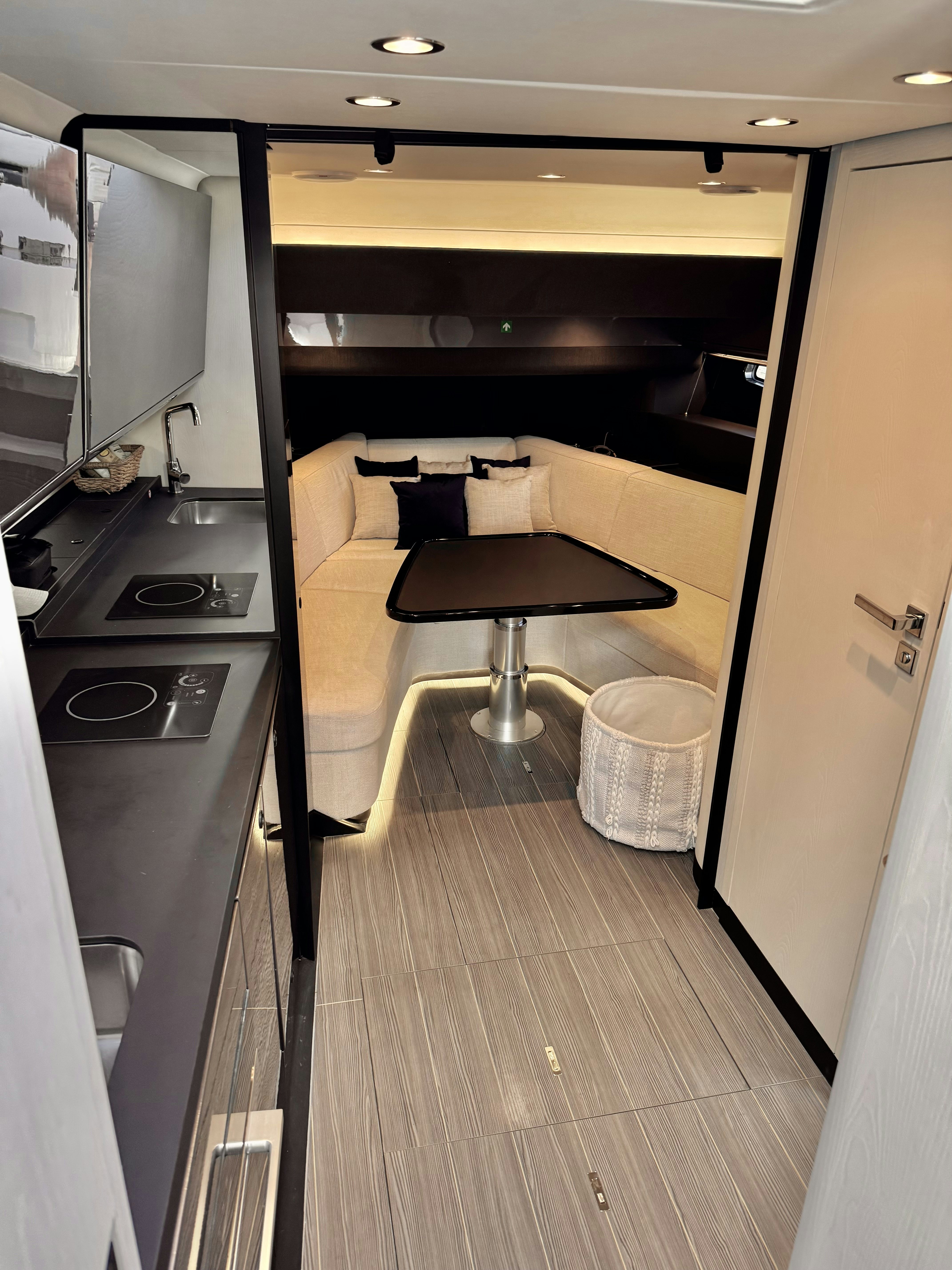 a kitchen with a table and chairs aboard GG Yacht for Sale
