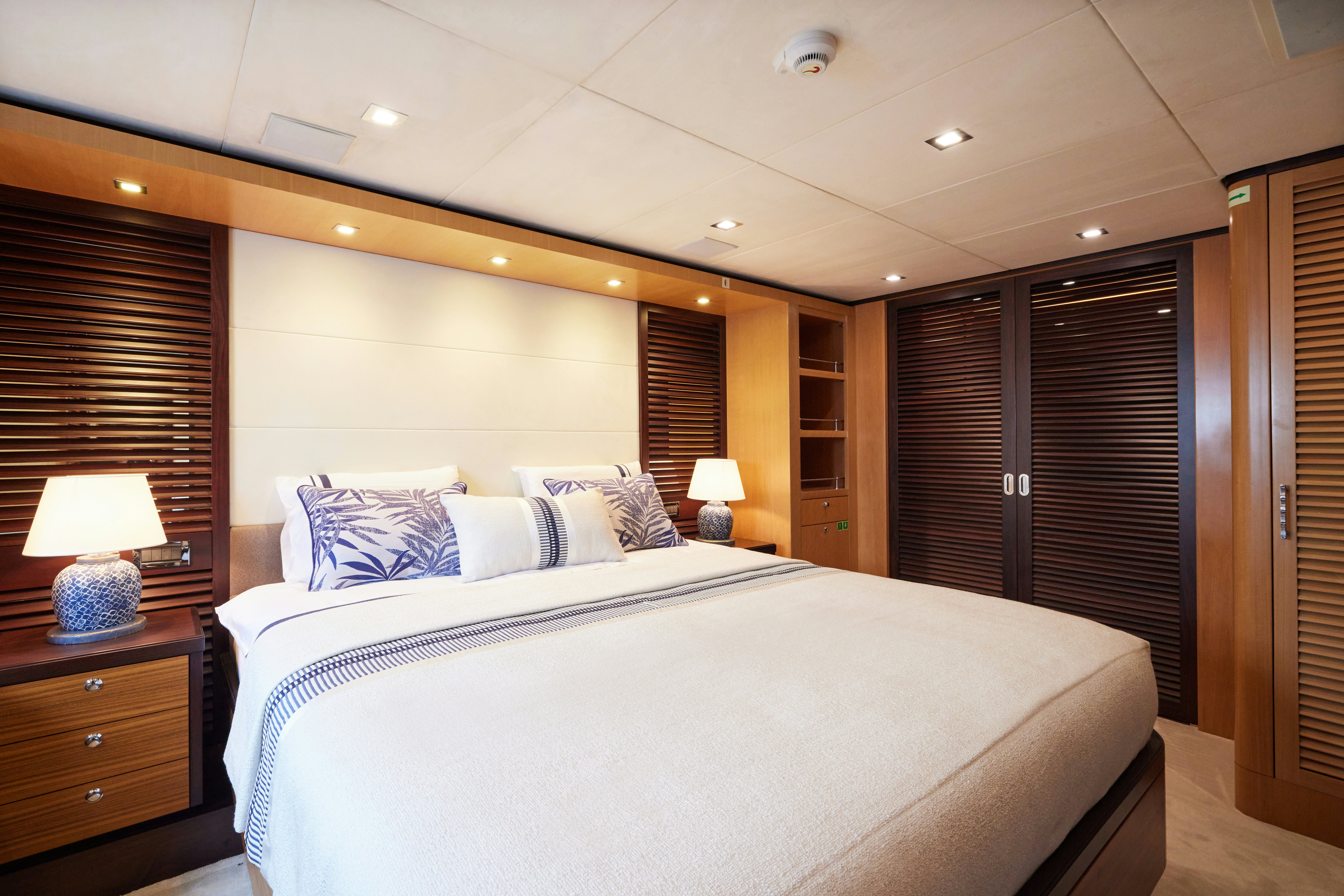 a large bed in a hotel room aboard AYSHA Yacht for Sale
