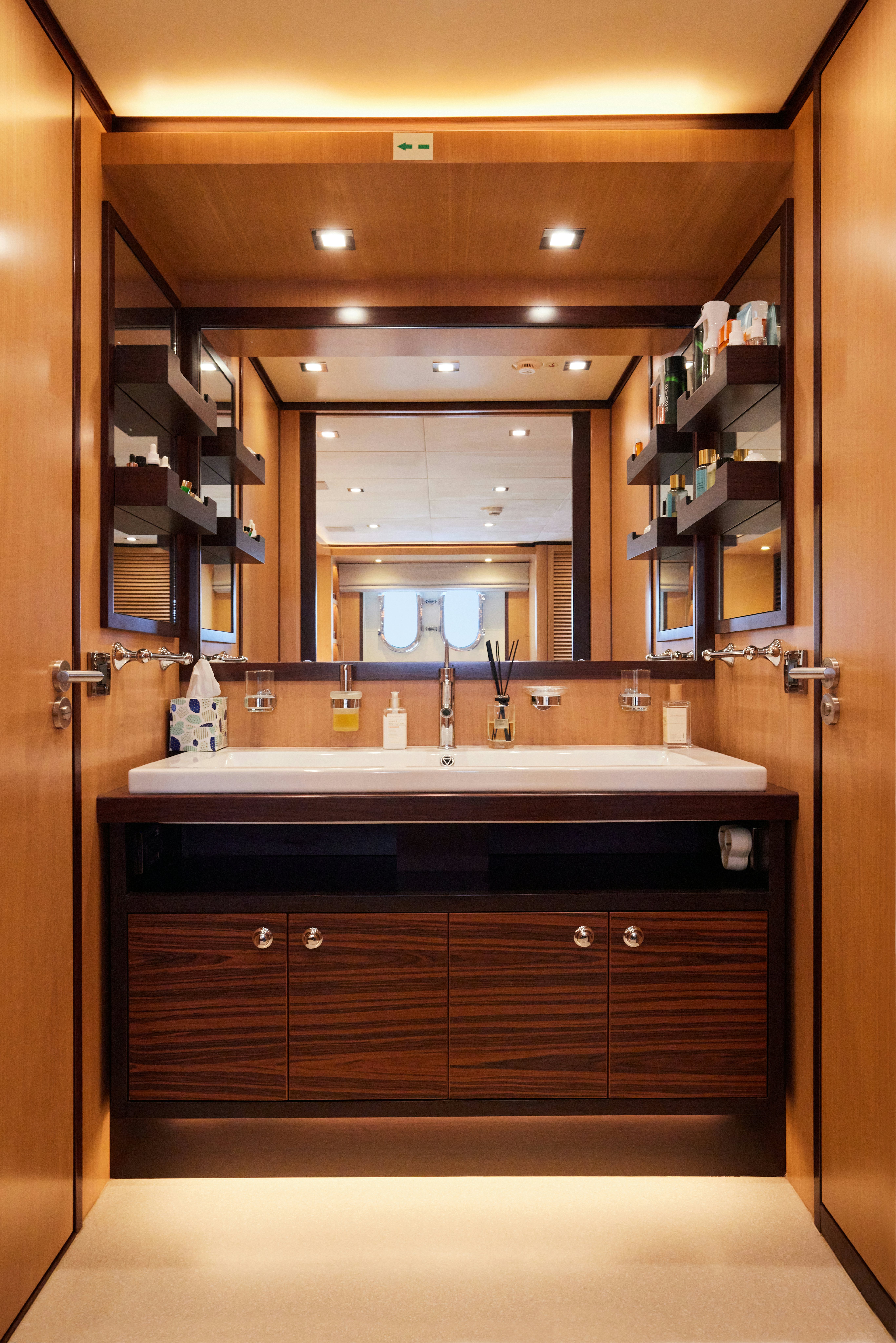a bathroom with a large mirror aboard AYSHA Yacht for Sale