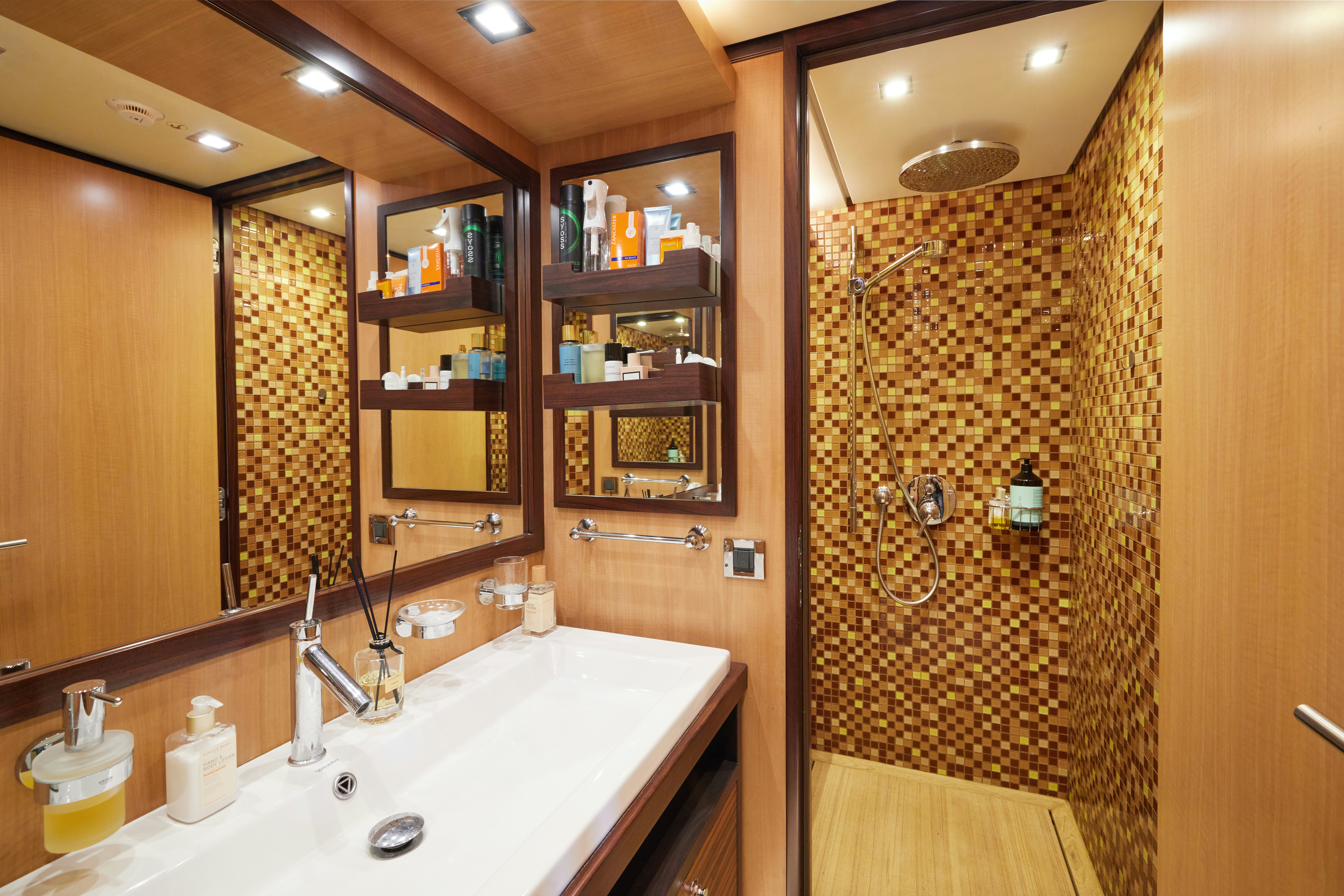 a bathroom with a shower curtain aboard AYSHA Yacht for Sale