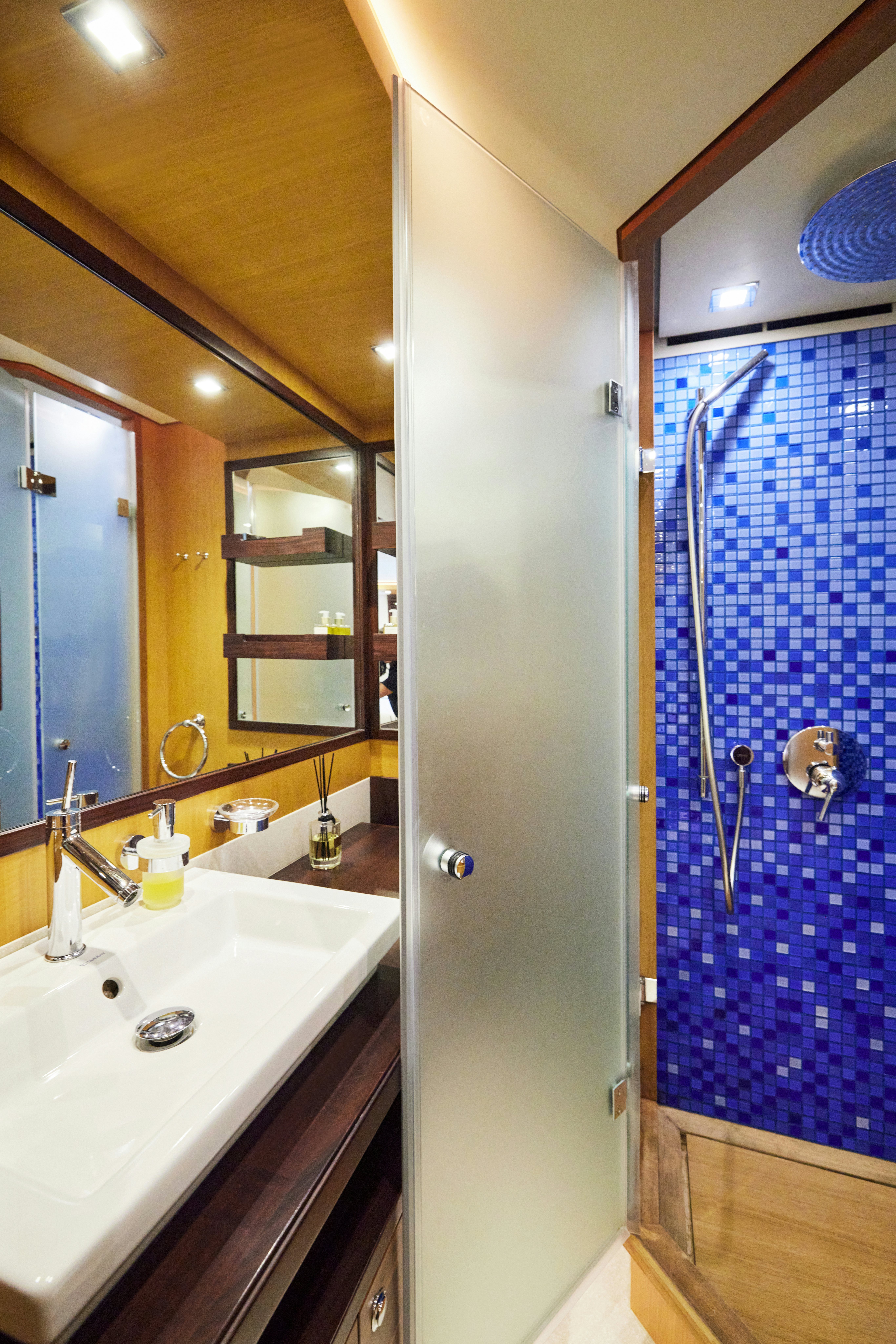 a bathroom with a shower and sink aboard AYSHA Yacht for Sale