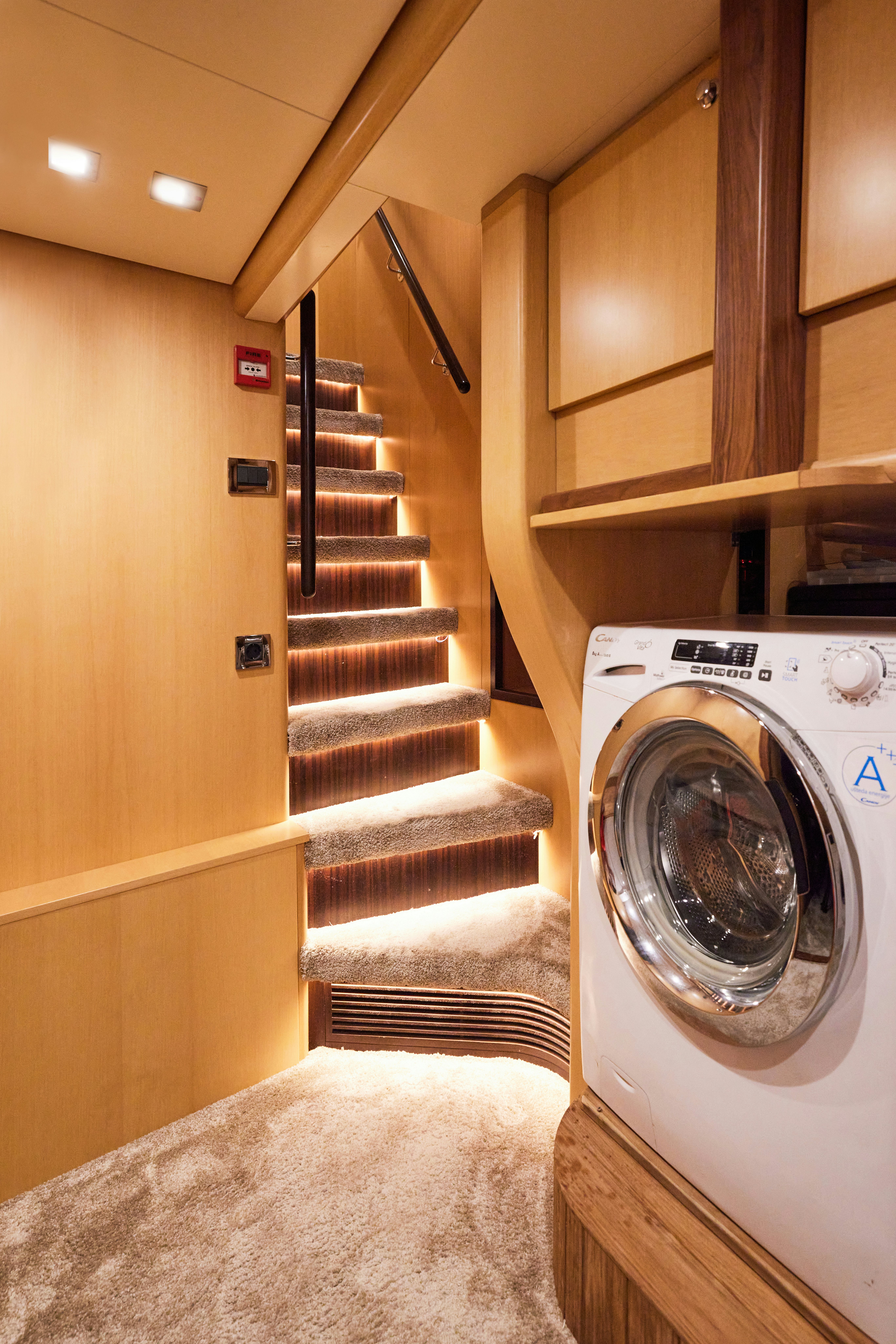 a kitchen with wooden cabinets aboard AYSHA Yacht for Sale