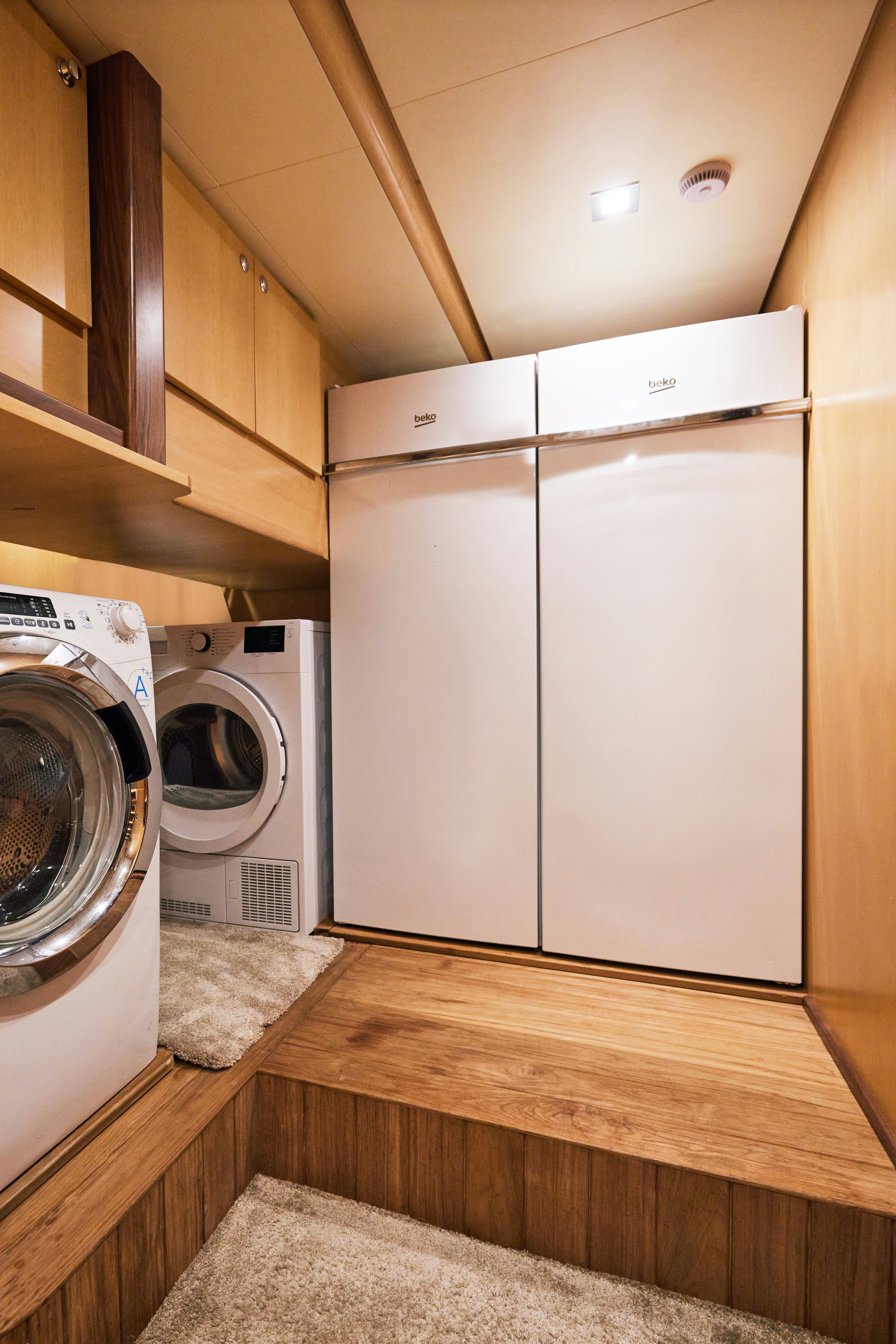 a kitchen with a washer and dryer aboard AYSHA Yacht for Sale