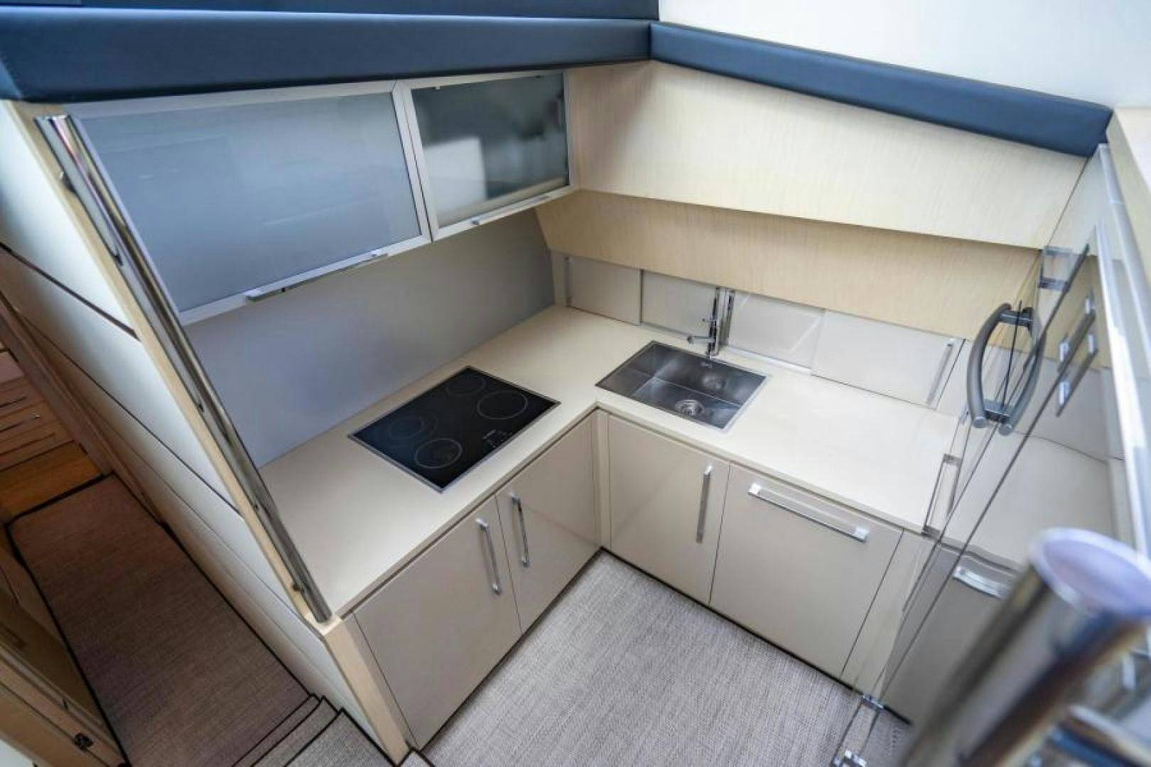 a kitchen with a sink and cabinets aboard EQUINOX Yacht for Sale