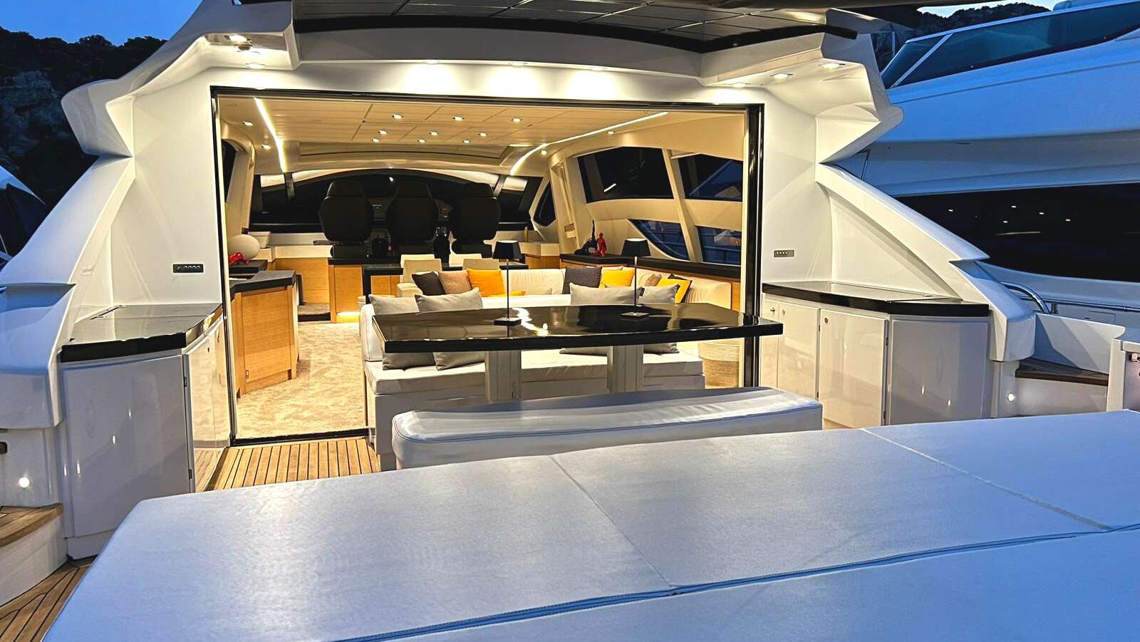 a room with a table and chairs aboard THYKE II Yacht for Charter