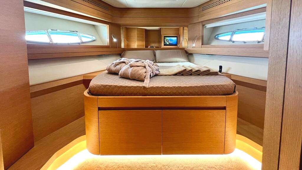 a bed in a room aboard THYKE II Yacht for Charter
