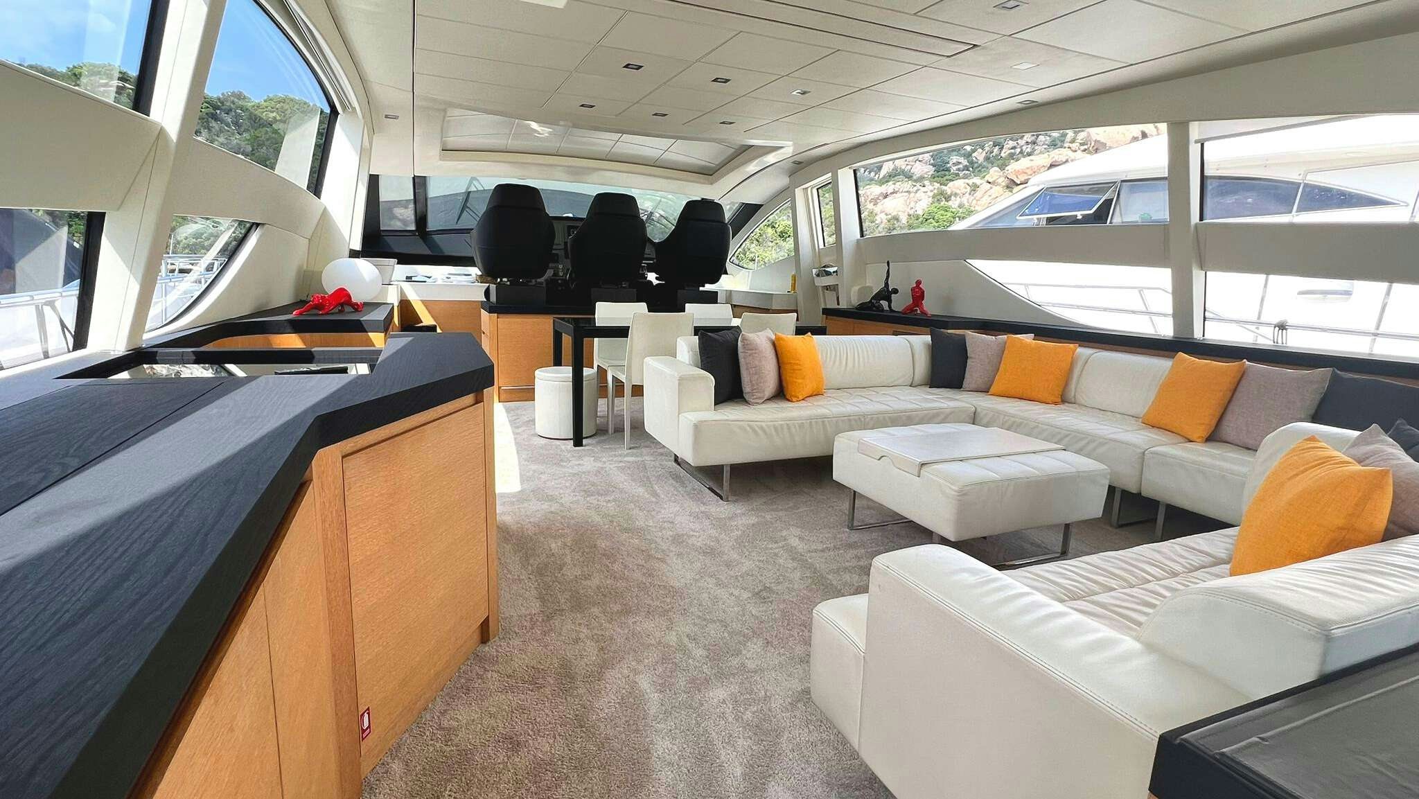 a room with a couch and a table aboard THYKE II Yacht for Charter