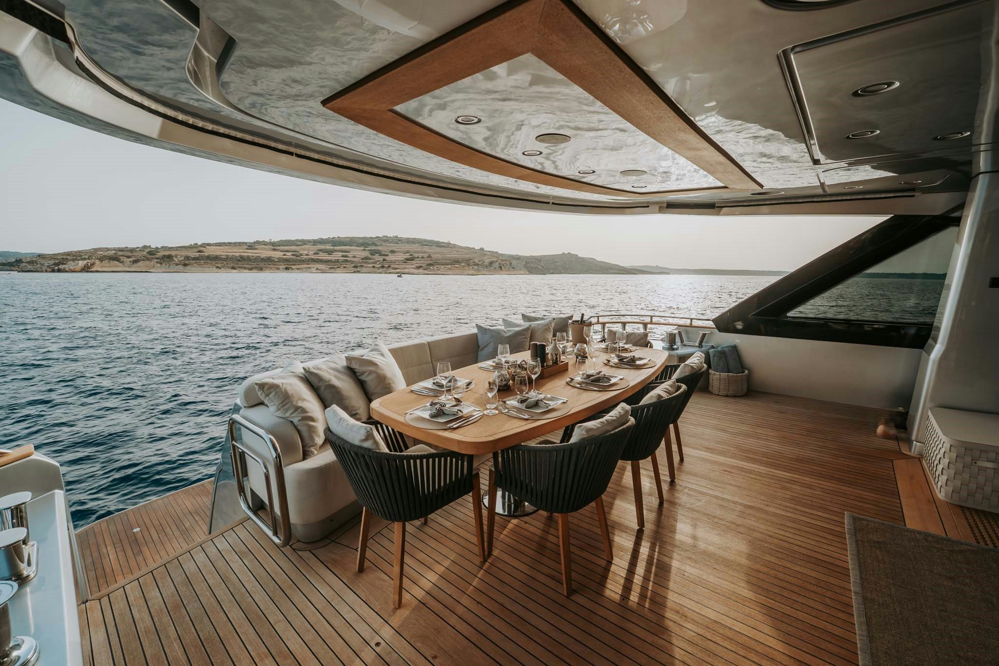 a table set for a meal on a boat aboard VENUS Yacht for Charter
