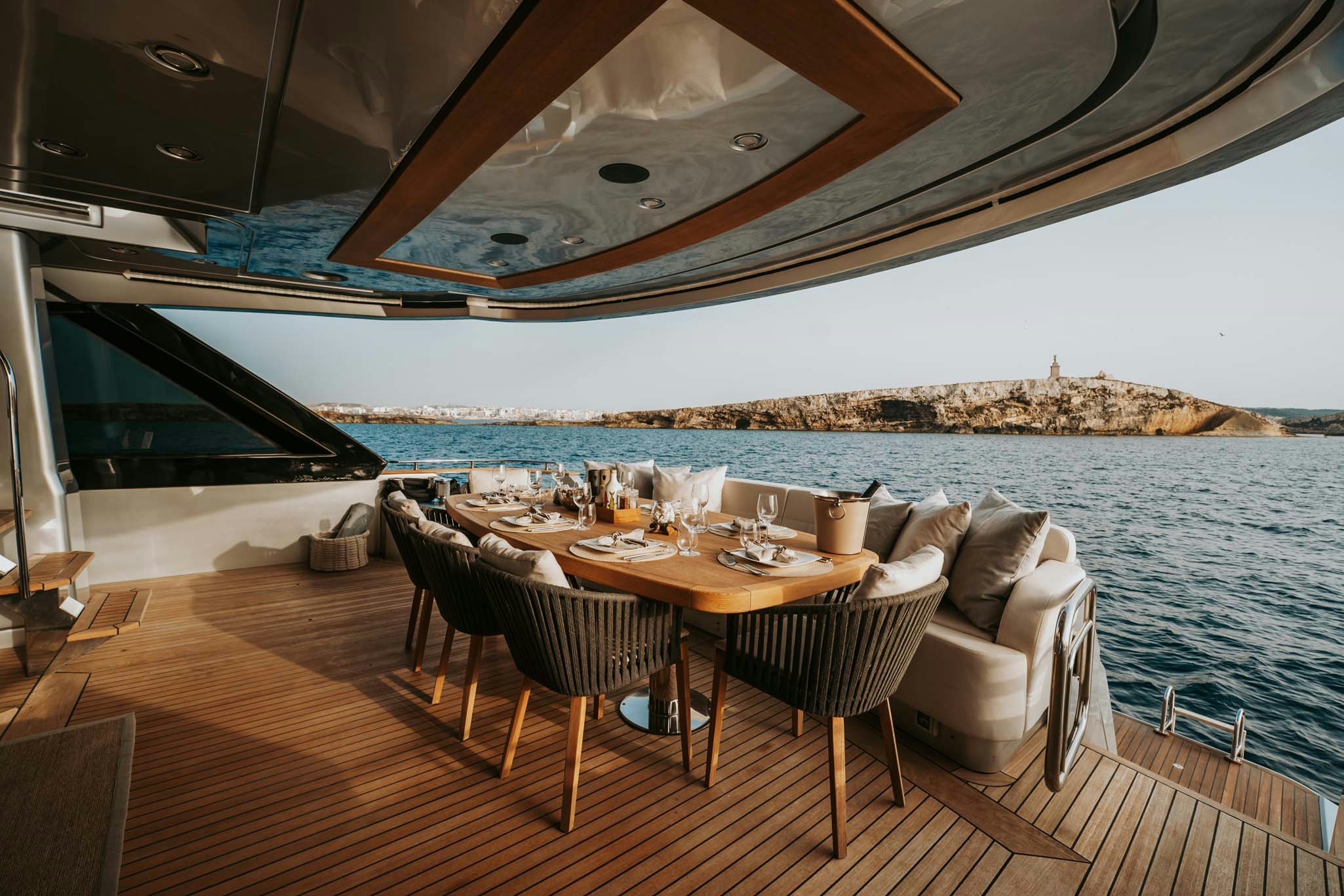 a table and chairs on a boat aboard VENUS Yacht for Charter