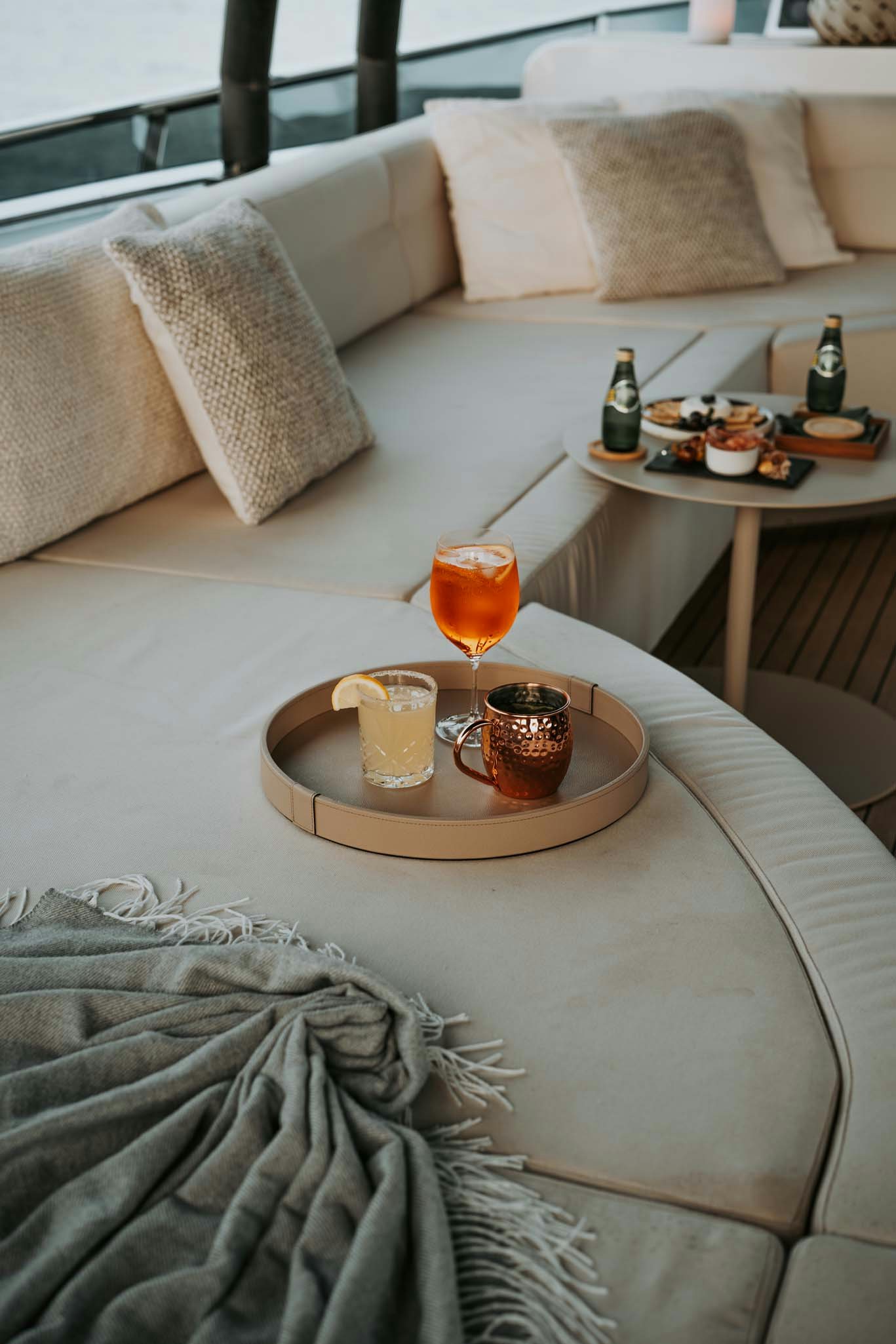 a glass of beer on a table aboard VENUS Yacht for Charter