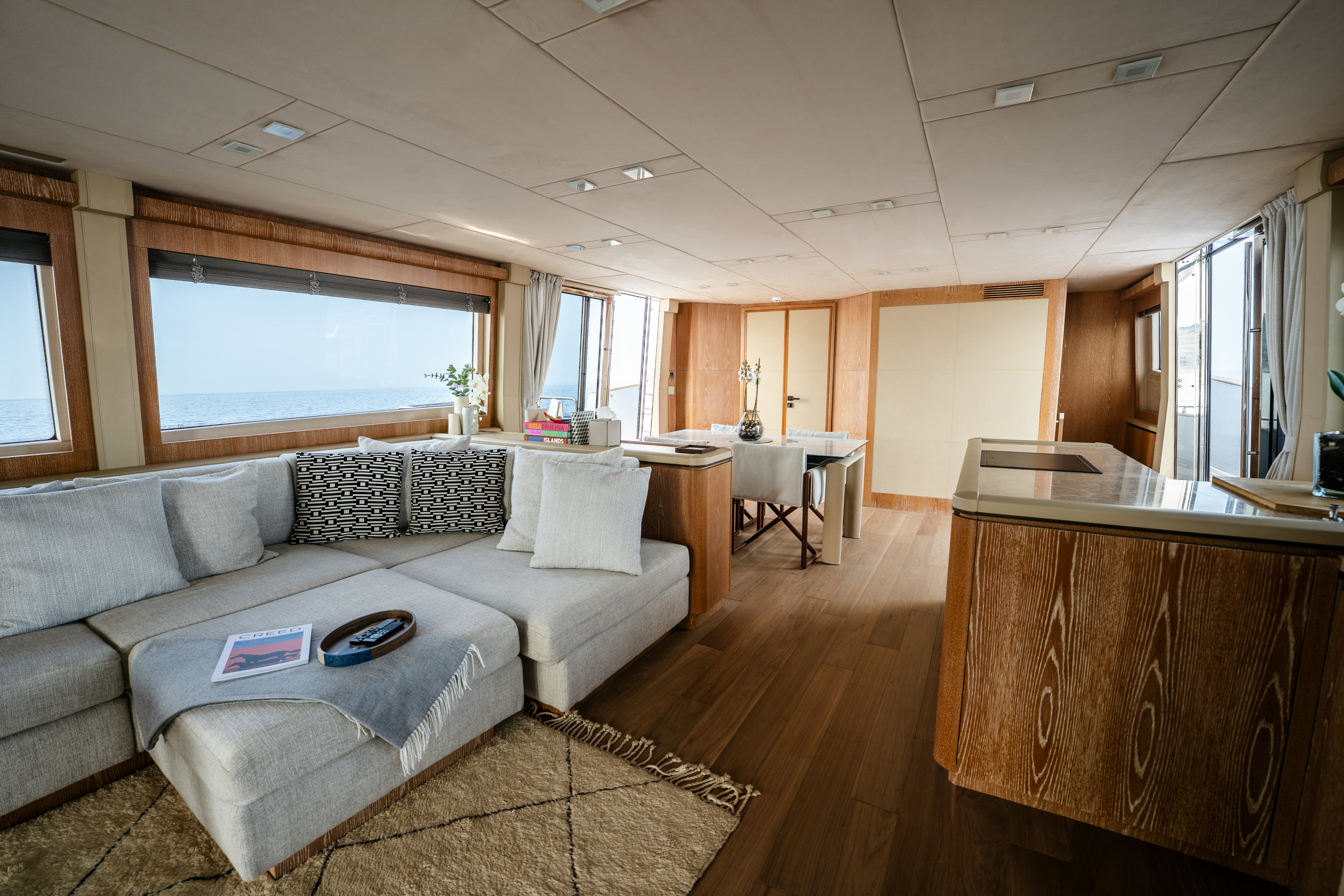 a living room with a couch and a table aboard VENUS Yacht for Sale