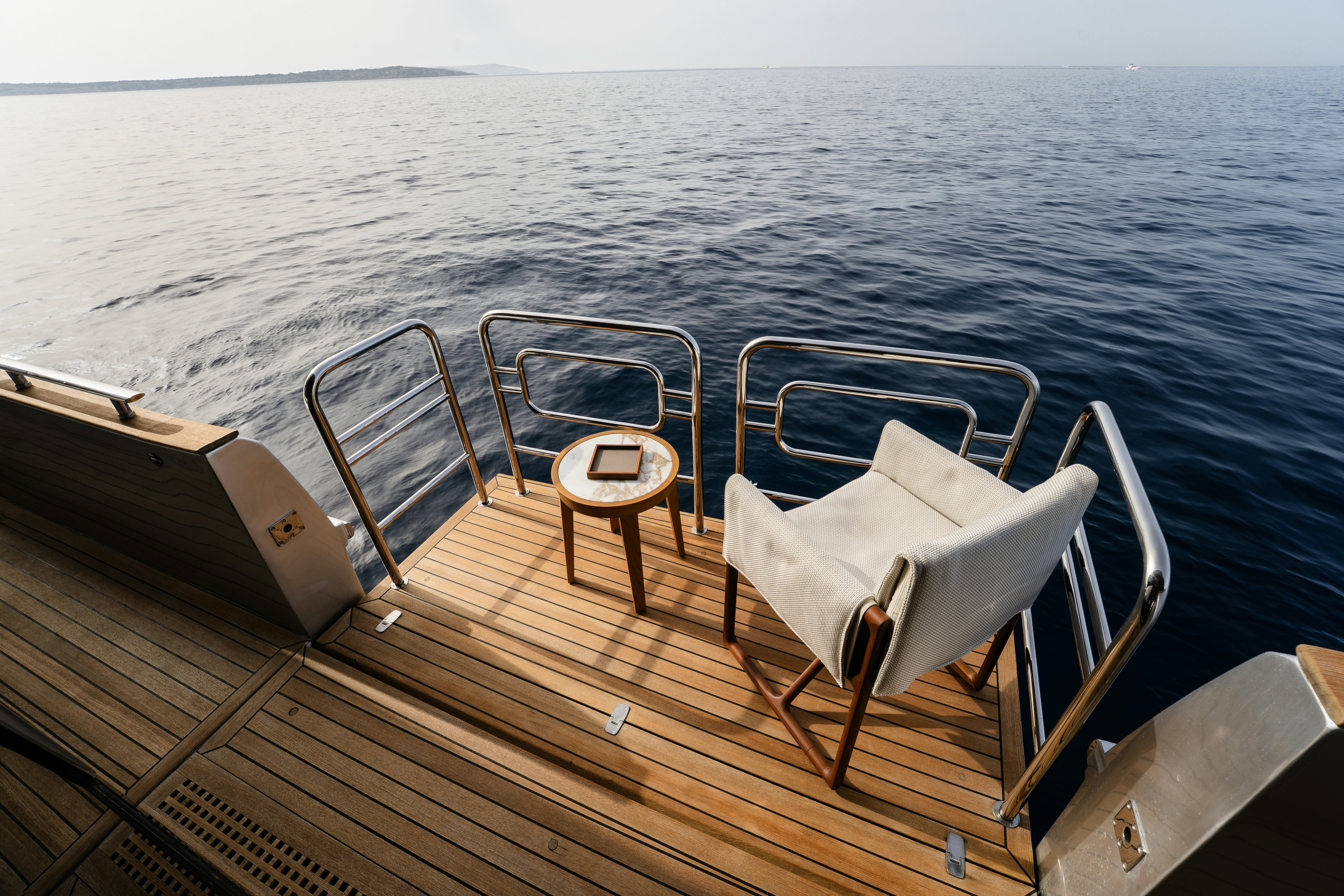 a deck with chairs on it aboard VENUS Yacht for Sale