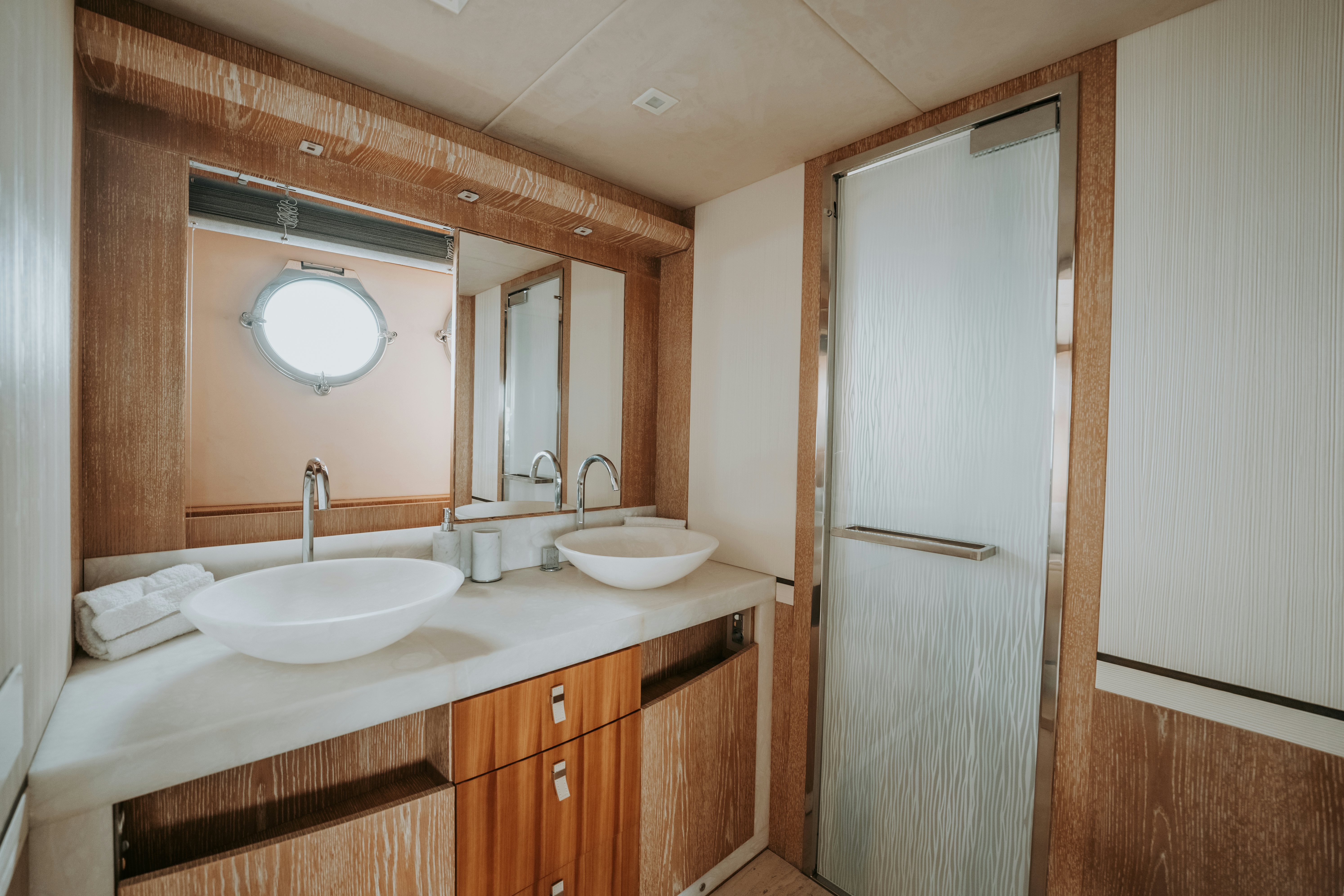 a bathroom with a sink and a mirror aboard VENUS Yacht for Sale