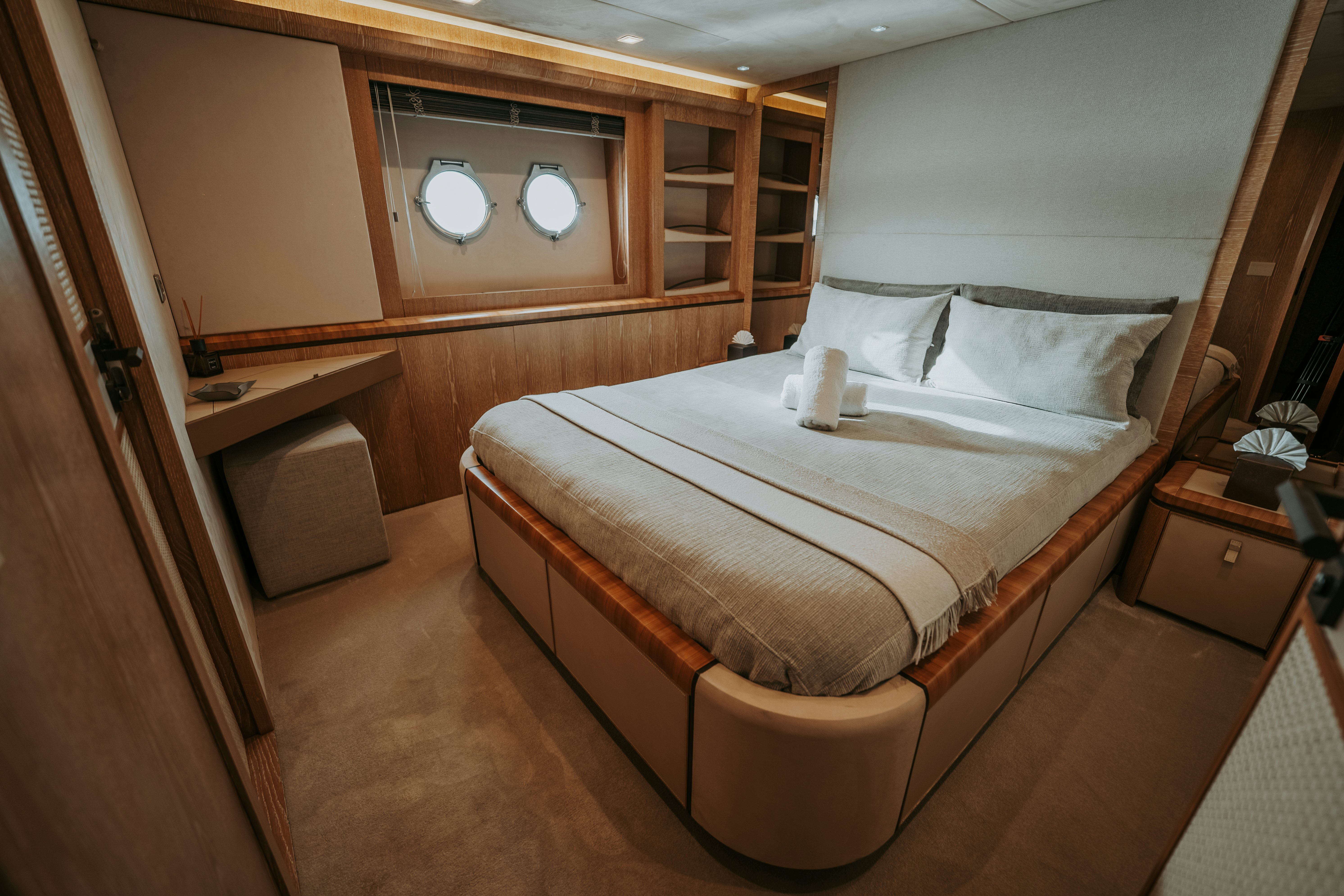 a bed in a room aboard VENUS Yacht for Sale