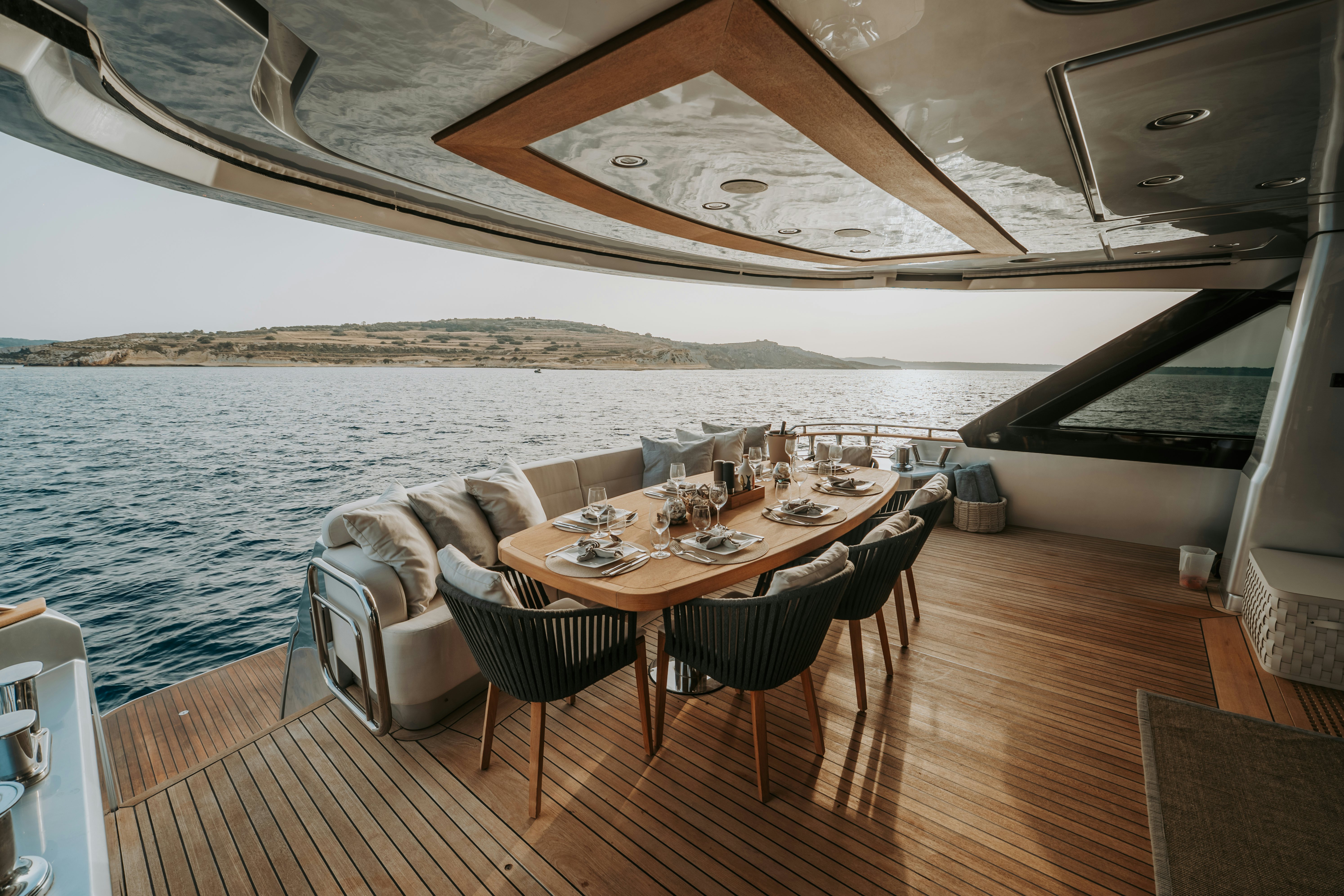 a table set for dinner on a boat aboard VENUS Yacht for Sale