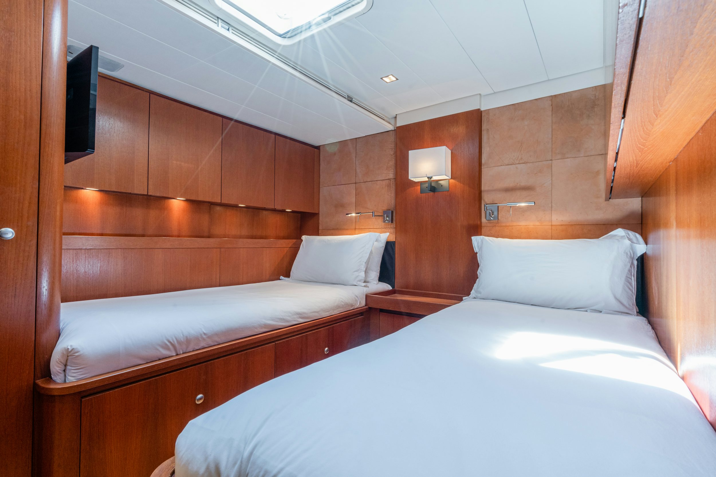 a room with two beds aboard SAVUKE Yacht for Sale