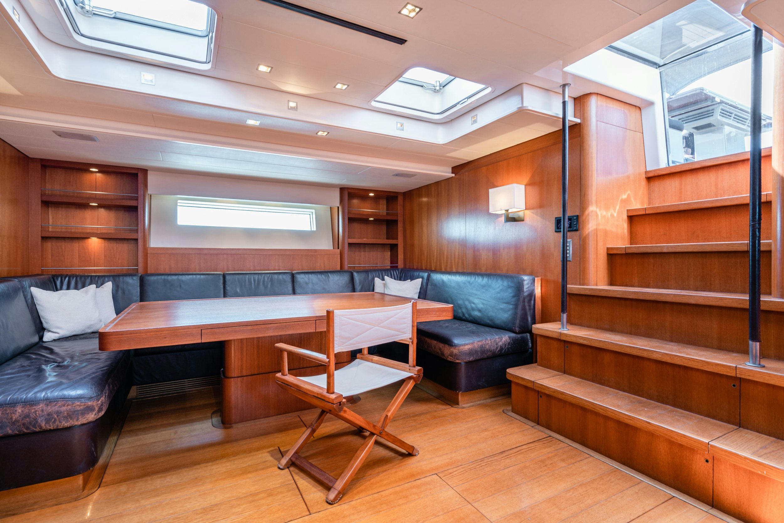 a room with a couch and a table aboard SAVUKE Yacht for Sale