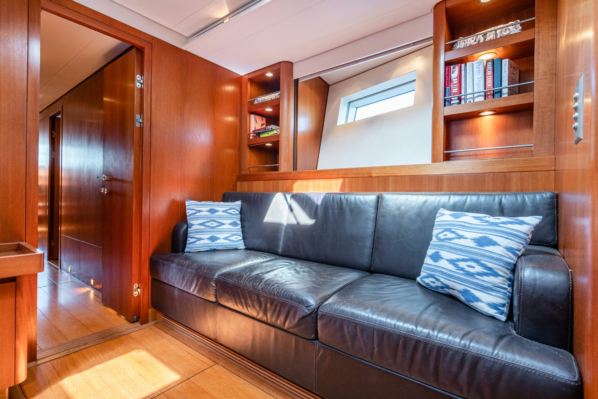a couch in a room aboard SAVUKE Yacht for Sale