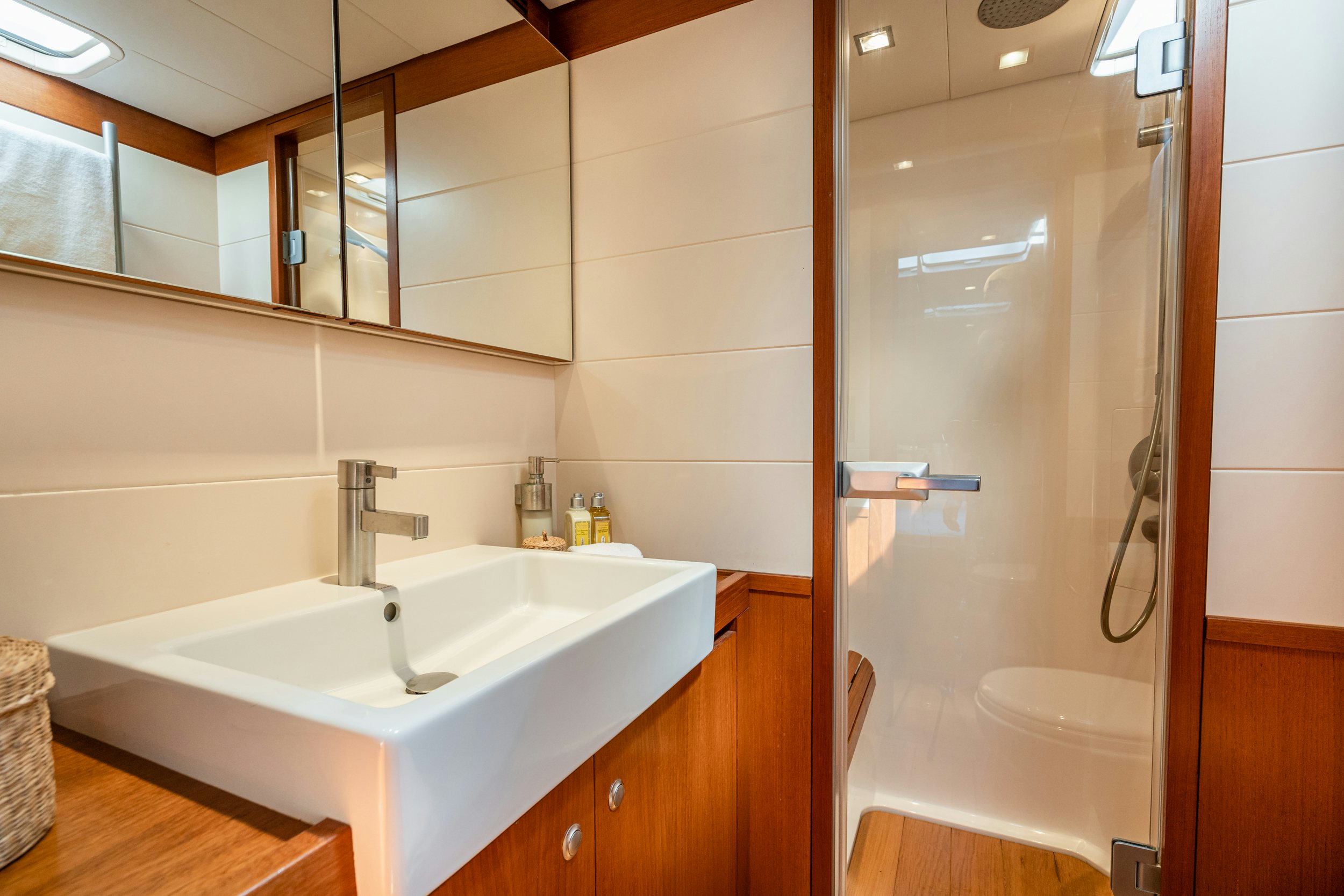 a bathroom with a sink and a shower aboard SAVUKE Yacht for Sale