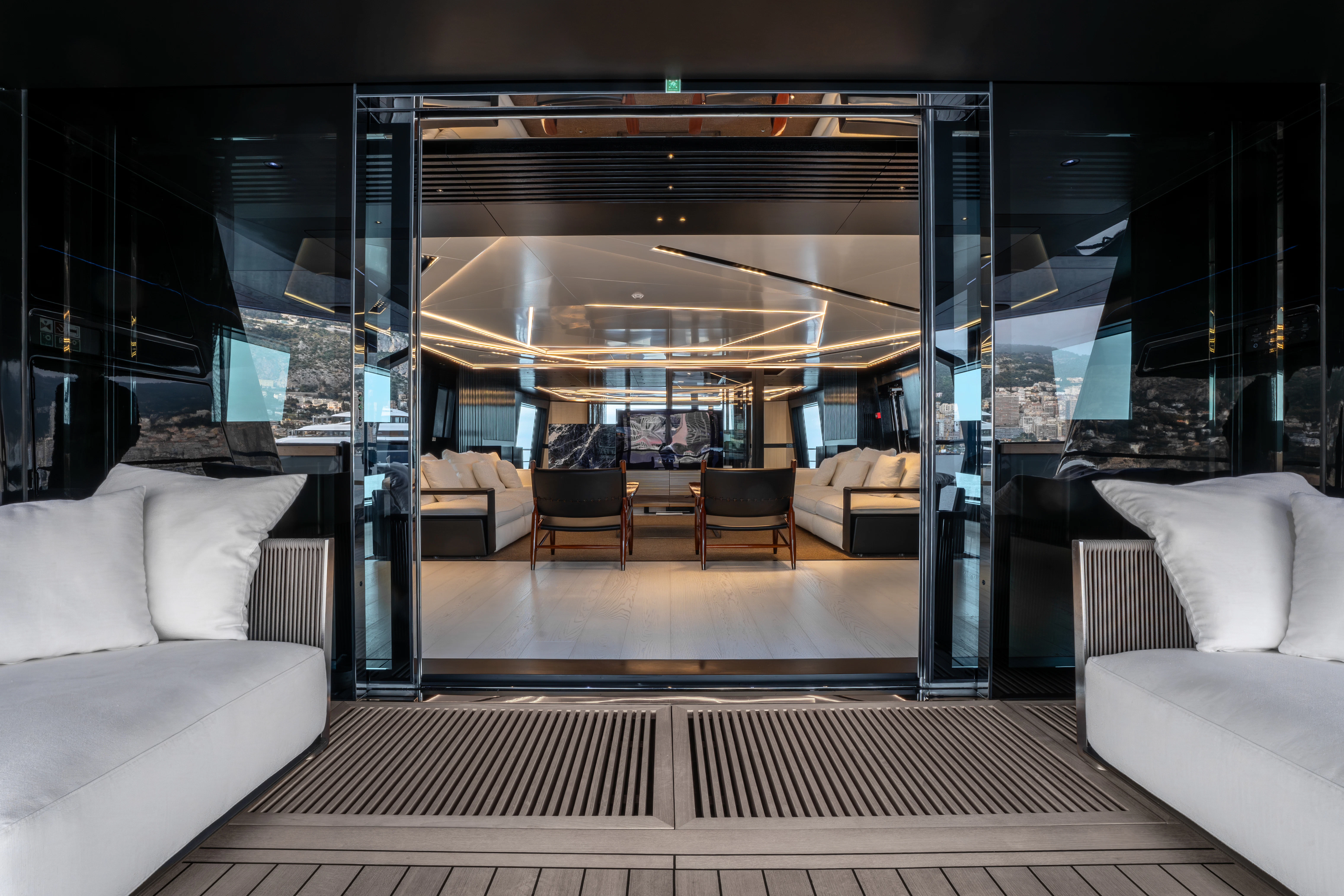 a room with couches and a table aboard K+ Yacht for Sale