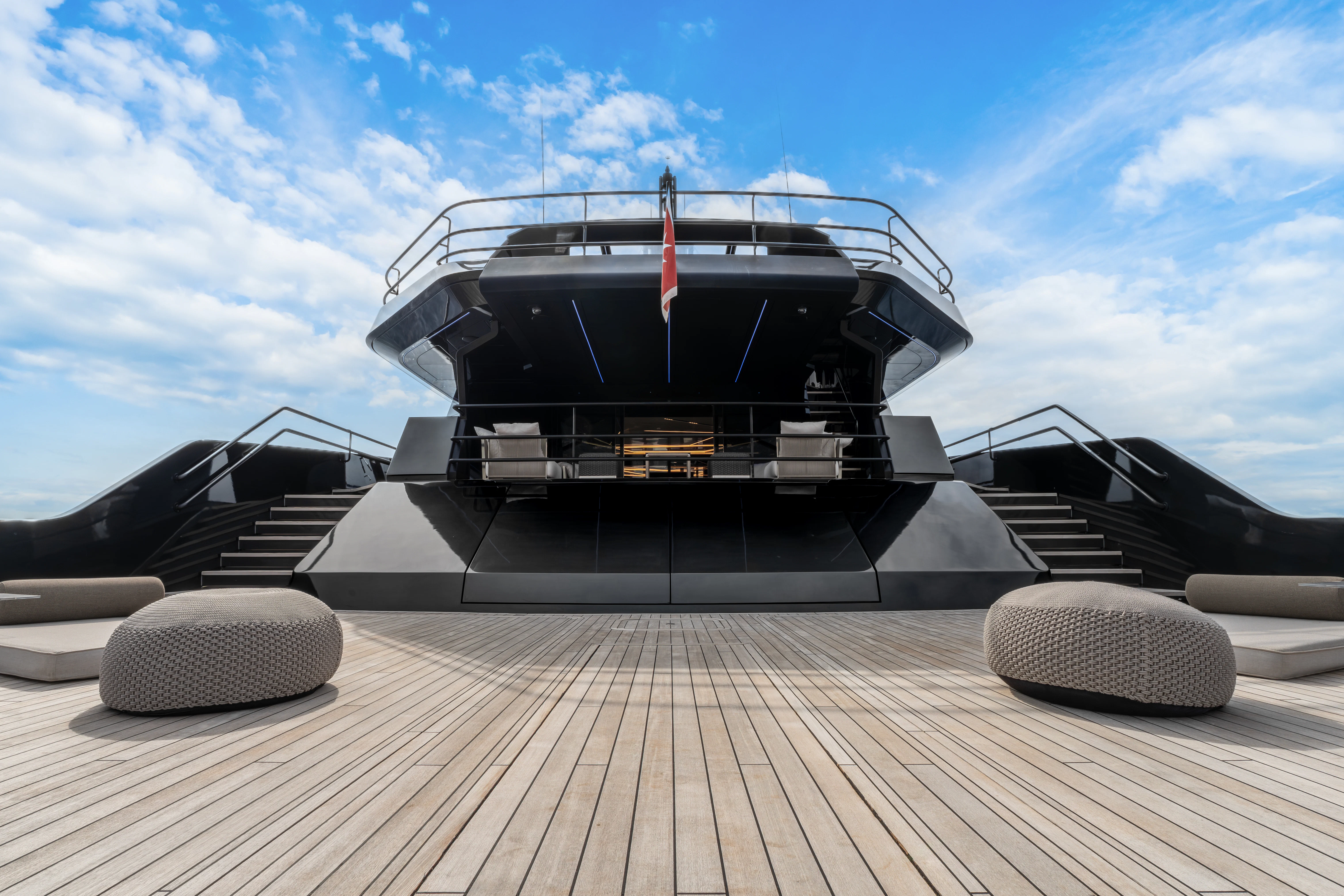 a large black and white boat on a dock aboard K+ Yacht for Sale