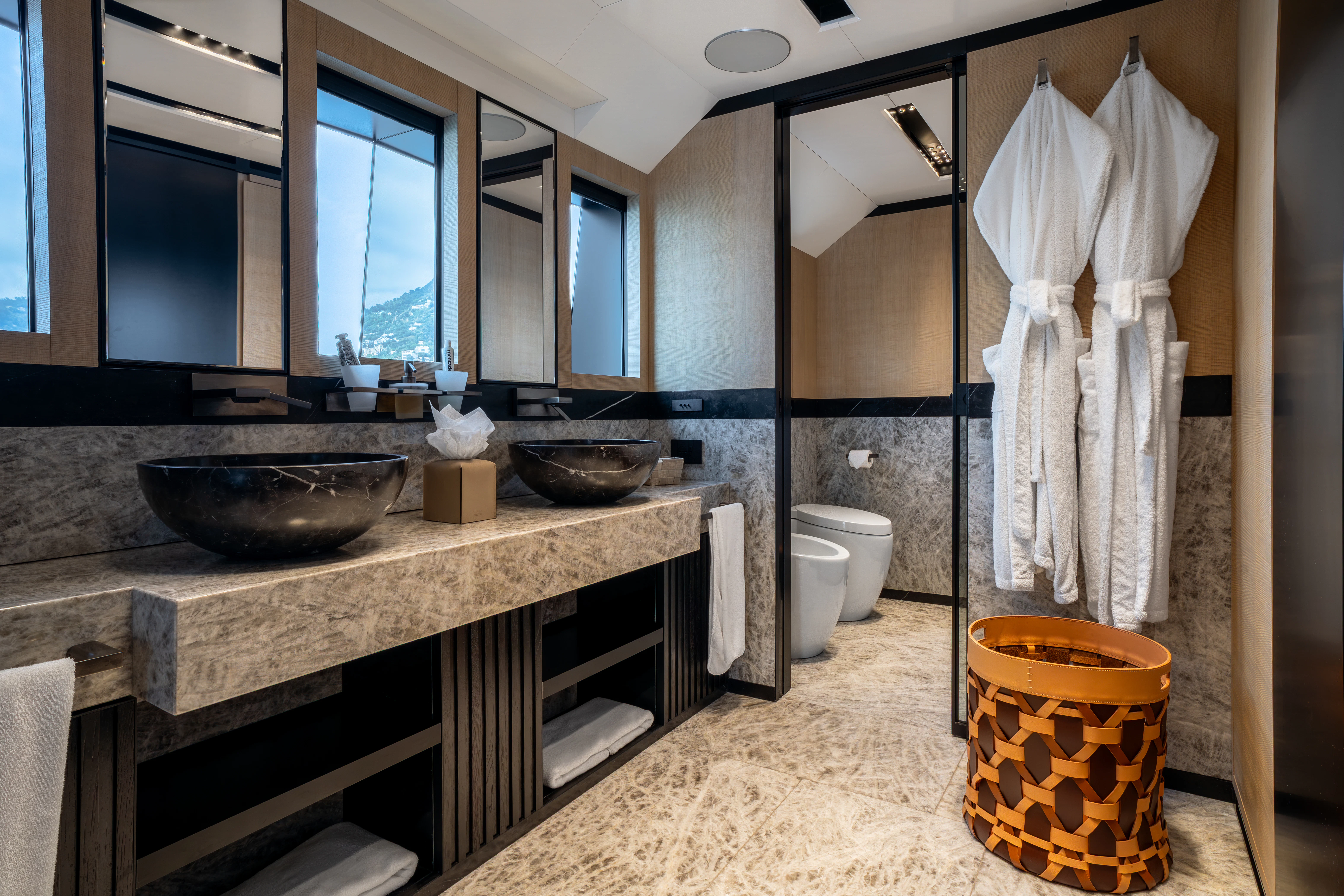 a bathroom with a countertop sink and a toilet aboard K+ Yacht for Sale