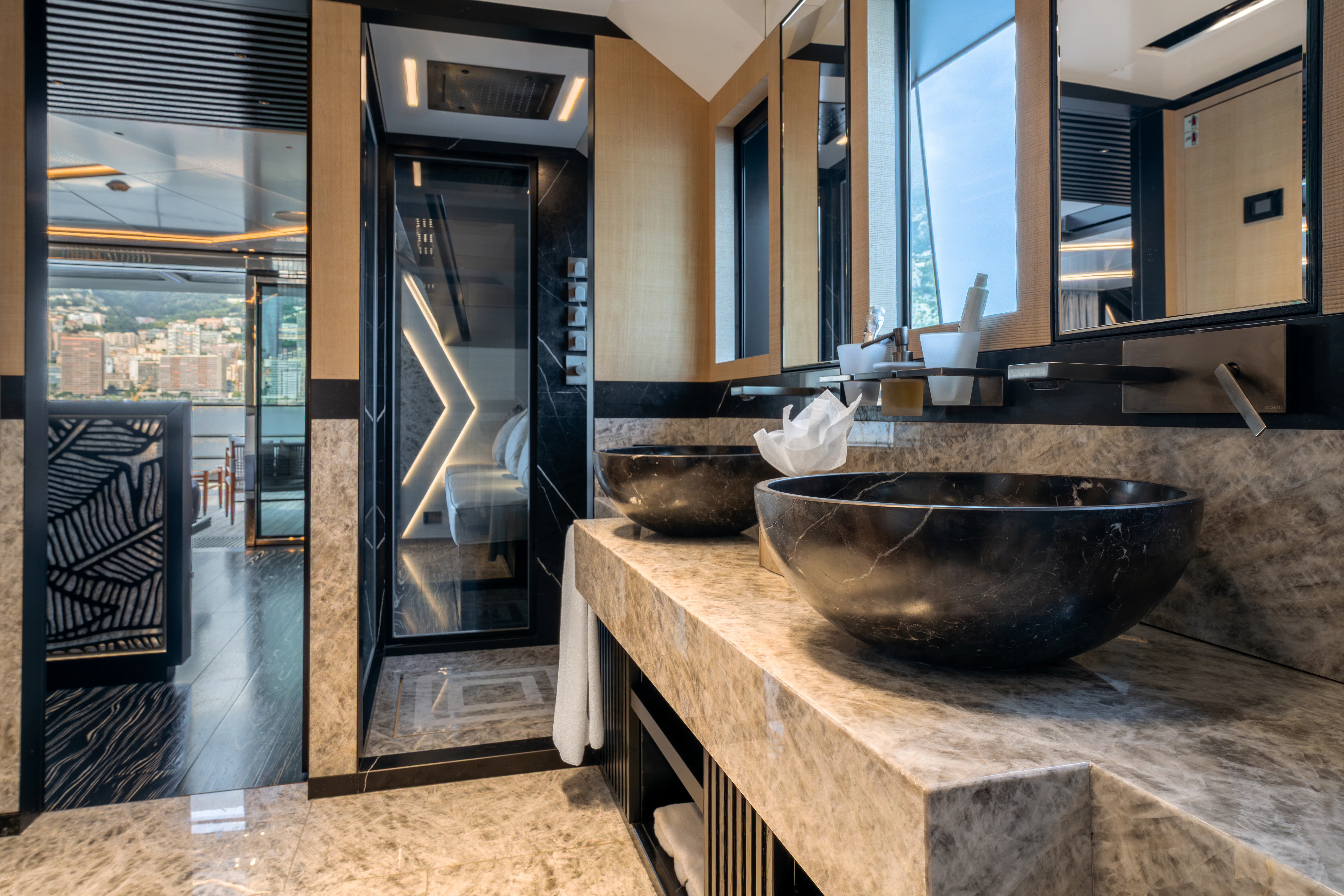 a modern bathroom with marble counter tops aboard K+ Yacht for Sale