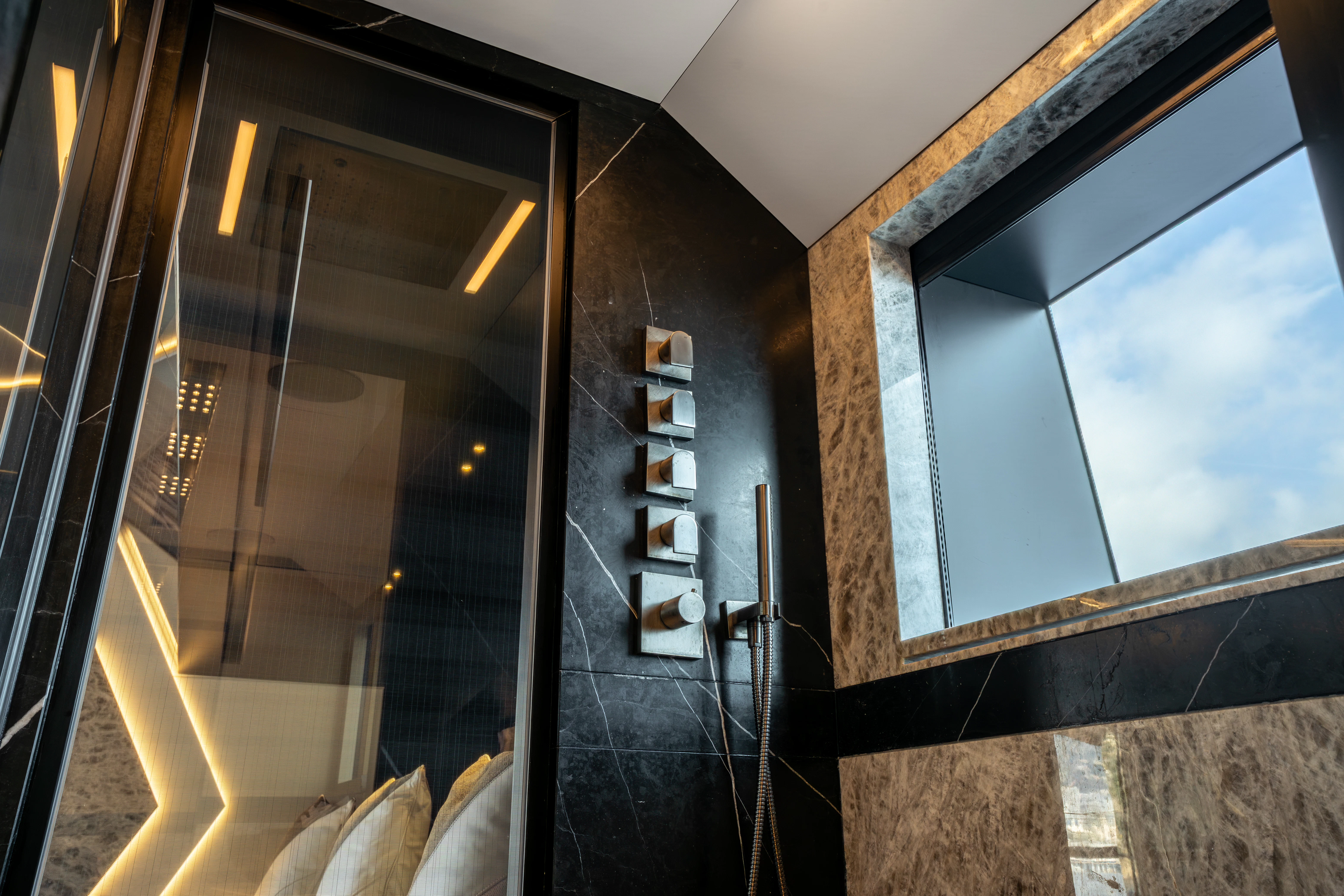 a room with a glass door aboard K+ Yacht for Sale