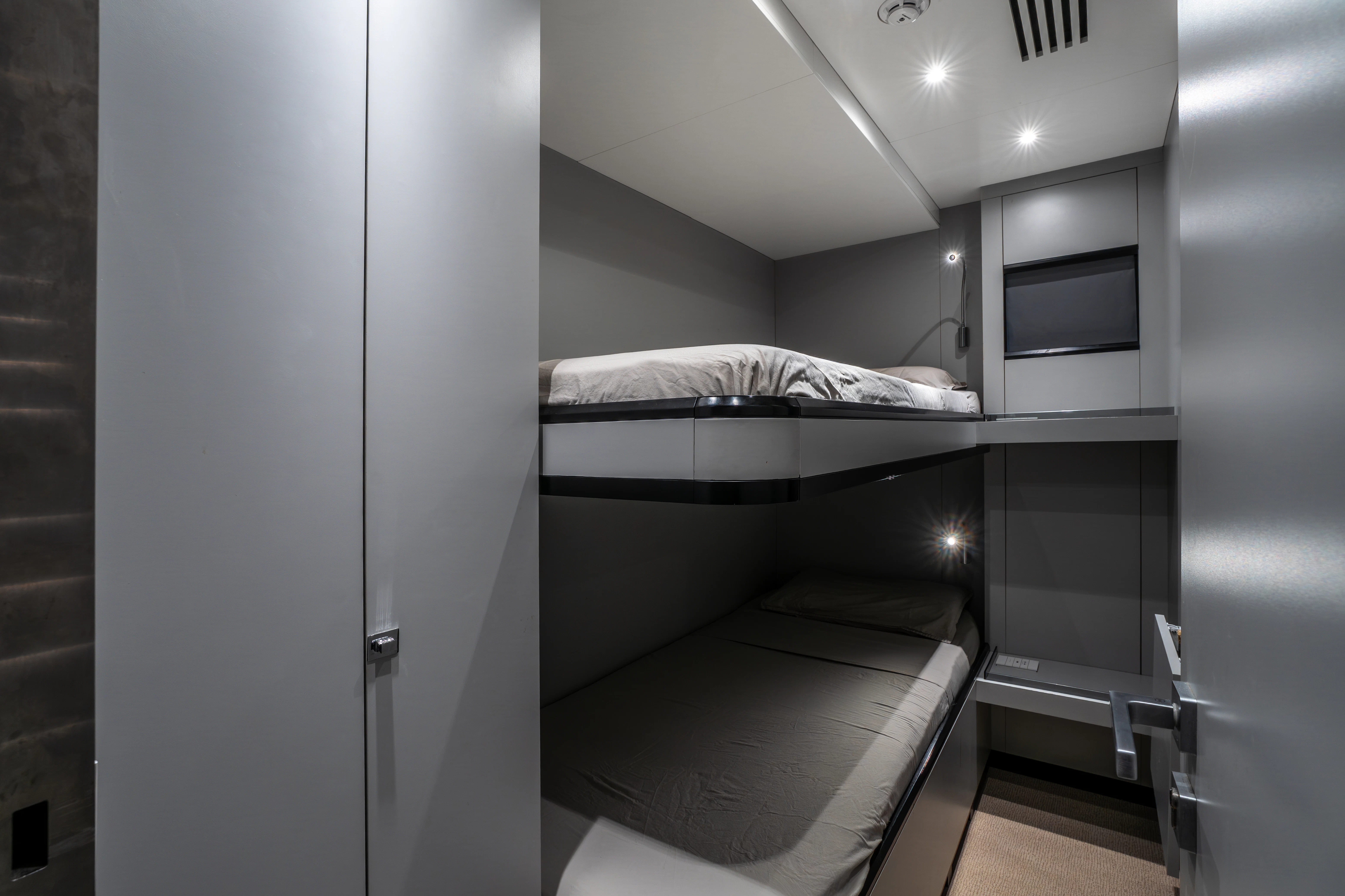 a room with bunk beds aboard K+ Yacht for Sale