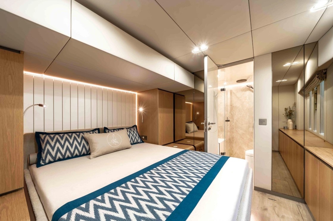 a large bedroom with a large bed aboard AMITATU Yacht for Charter