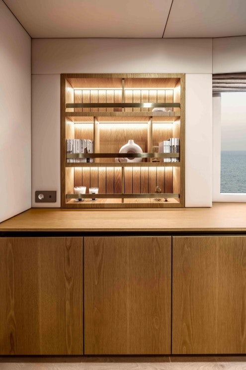 a glass case with a shelf aboard AMITATU Yacht for Charter