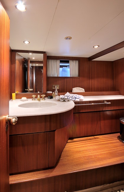 a bathroom with a large mirror aboard BLUE LADY Yacht for Sale