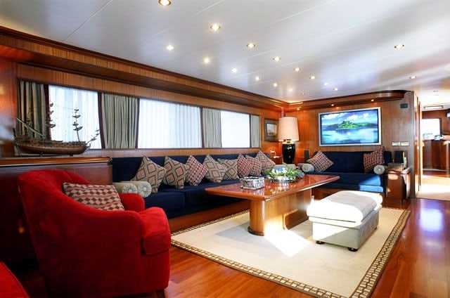 a living room with a large screen aboard BLUE LADY Yacht for Sale