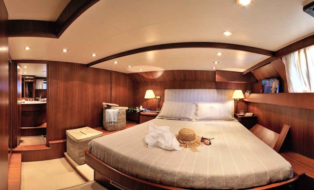 a bed in a room aboard BLUE LADY Yacht for Sale