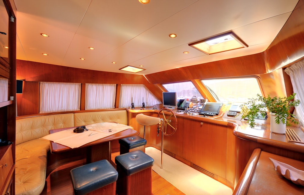 an office with a desk and chairs aboard BLUE LADY Yacht for Sale