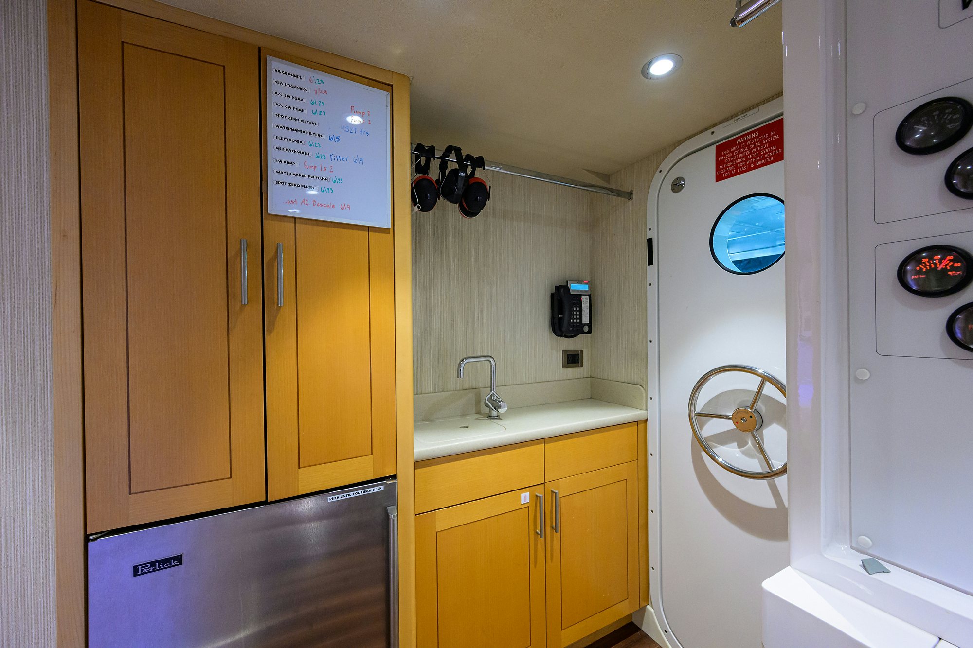 a bathroom with yellow cabinets aboard REMY ROO Yacht for Sale