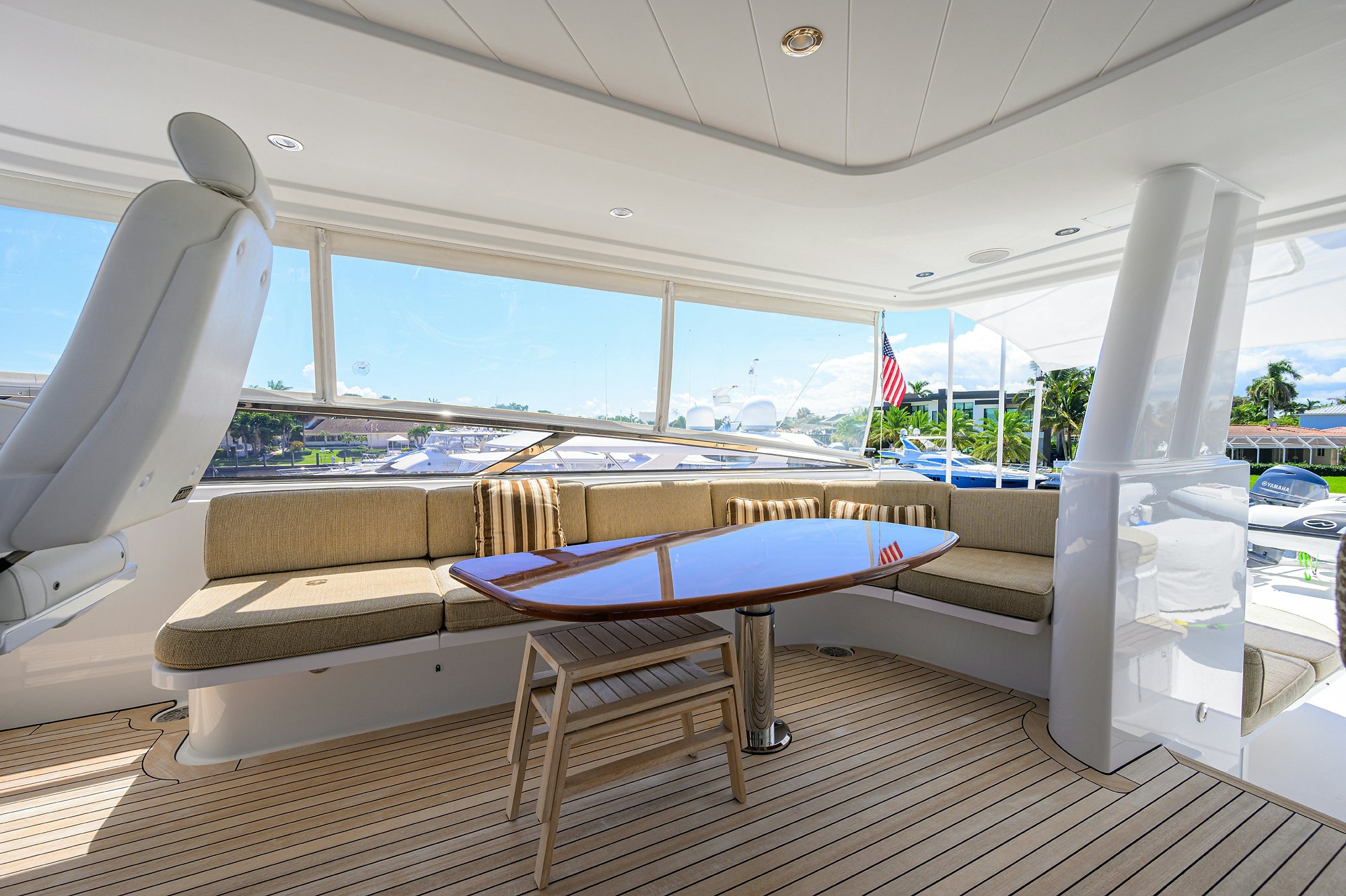 a pool table and chairs on a deck aboard REMY ROO Yacht for Sale