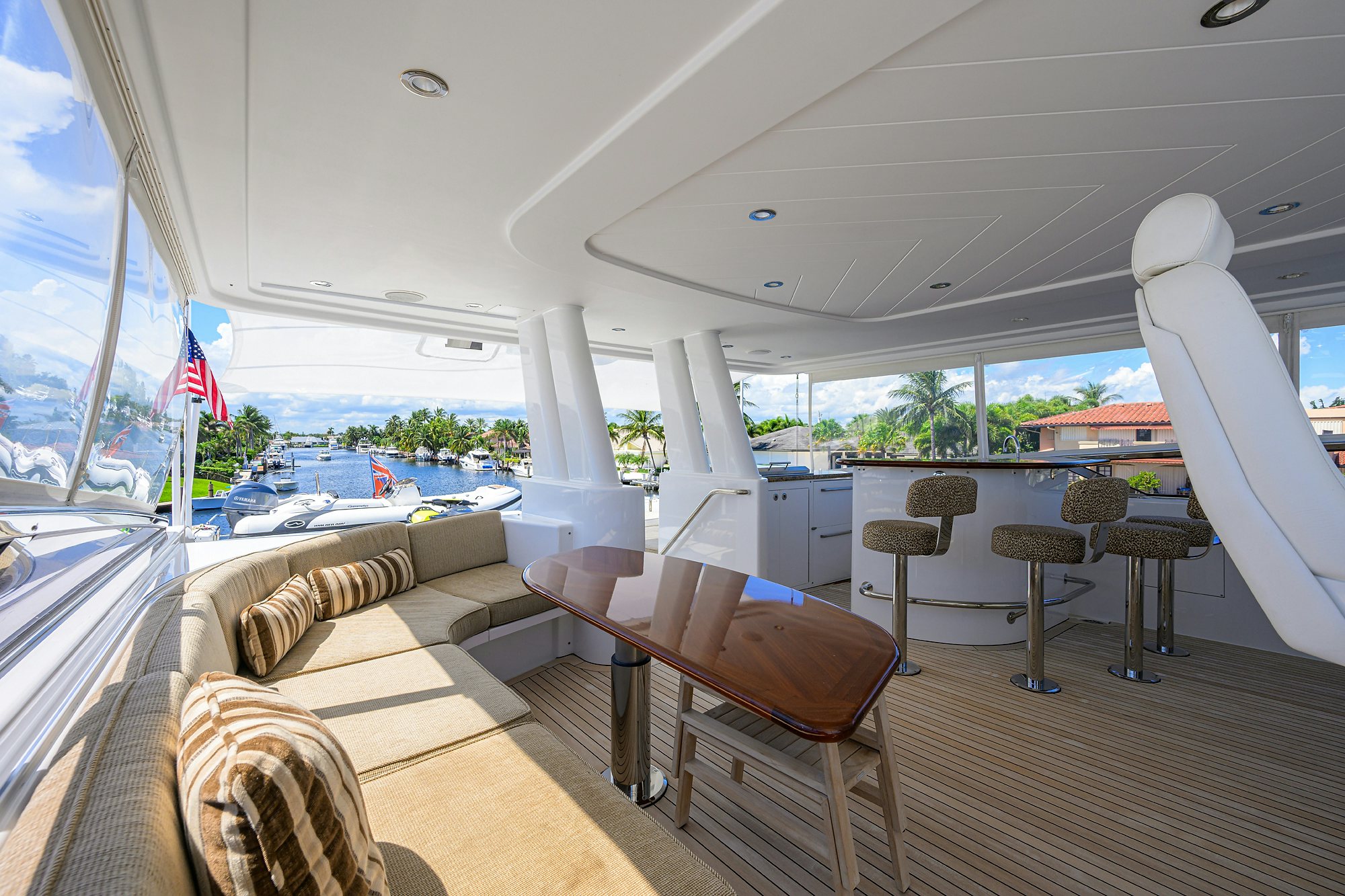 a large room with a couch and chairs and a table aboard REMY ROO Yacht for Sale