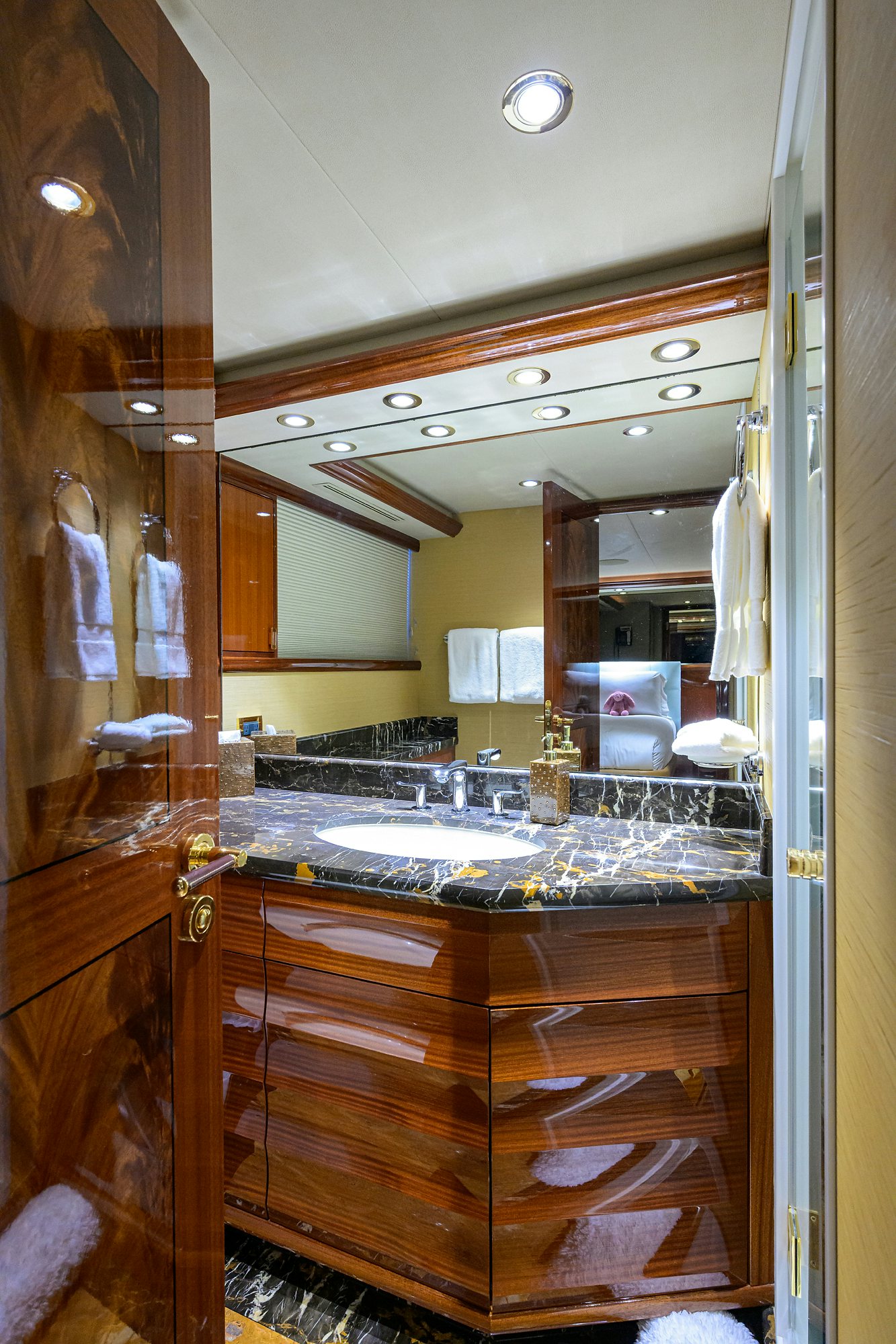 a bathroom with a large mirror aboard REMY ROO Yacht for Sale