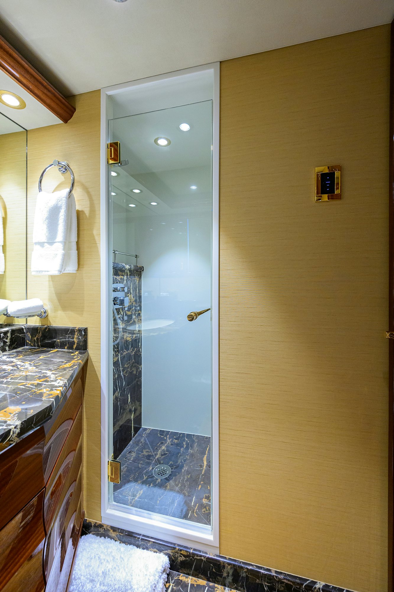 a bathroom with a glass shower aboard REMY ROO Yacht for Sale