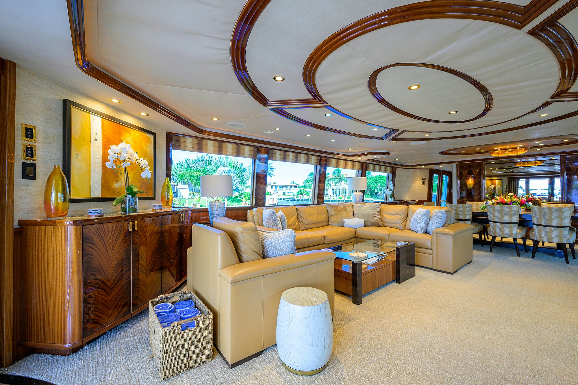 a living room with a large chandelier aboard REMY ROO Yacht for Sale