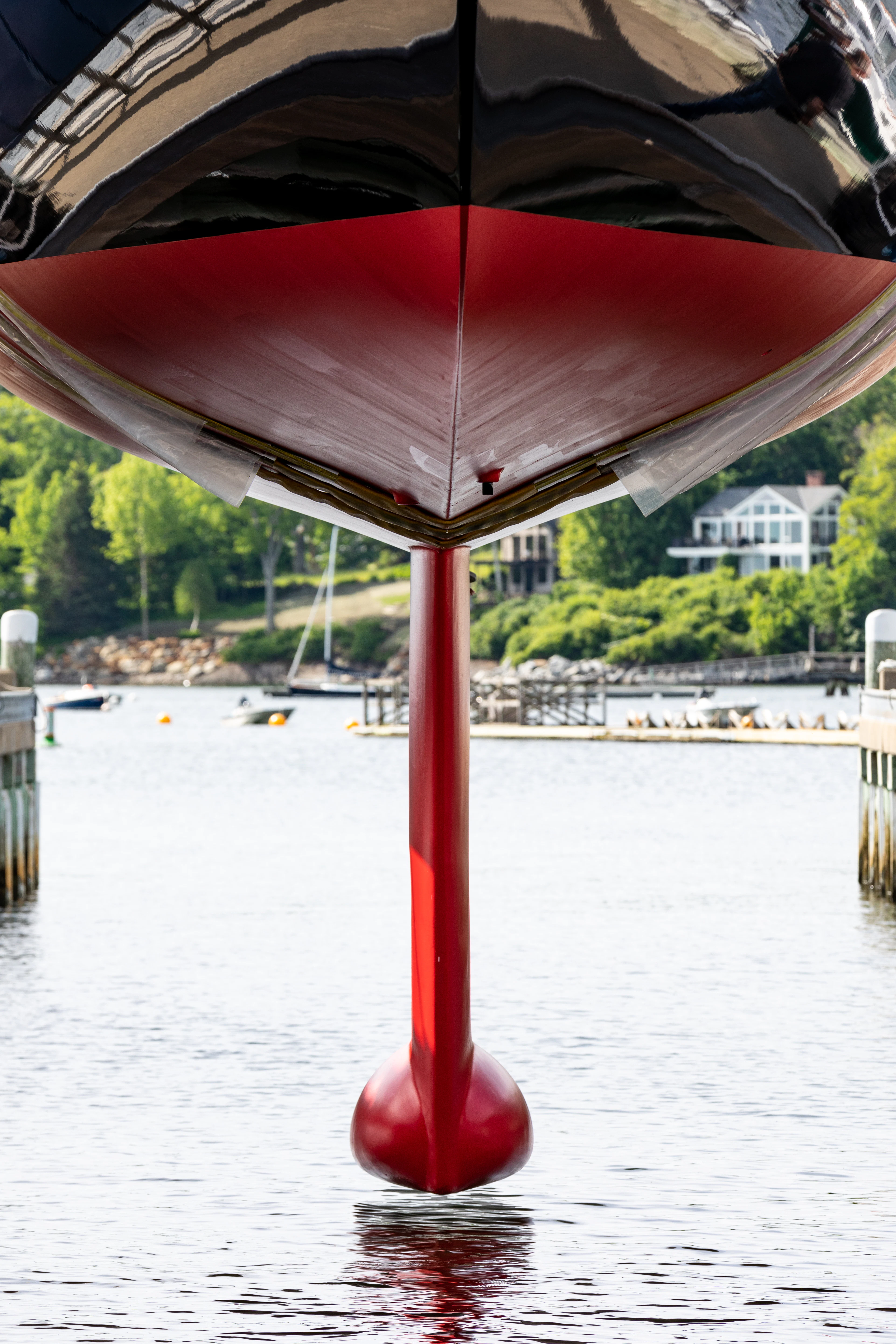 a red umbrella on a pole in the water aboard FALCON Yacht for Sale