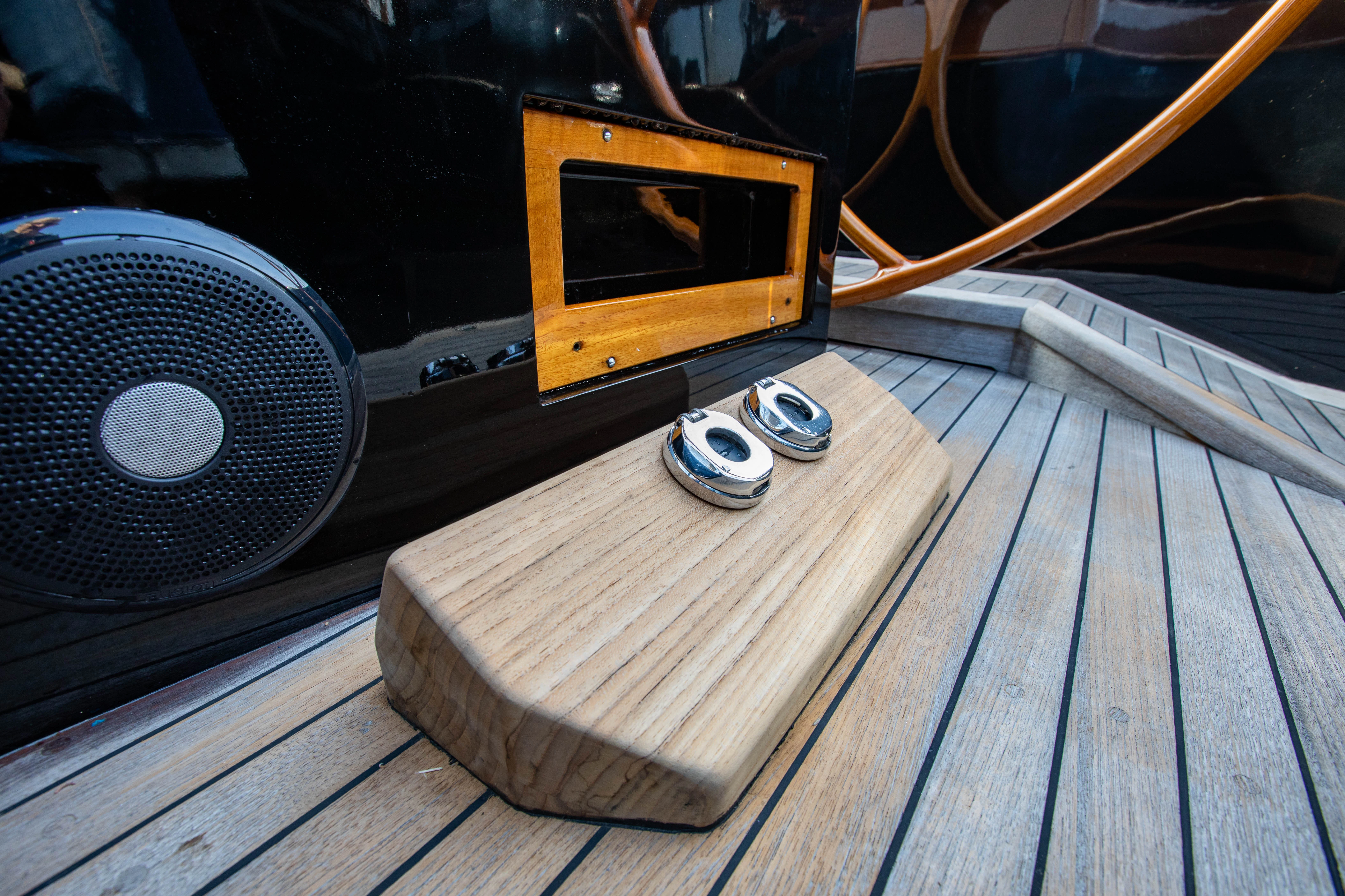 a wood table with a speaker on it aboard FALCON Yacht for Sale