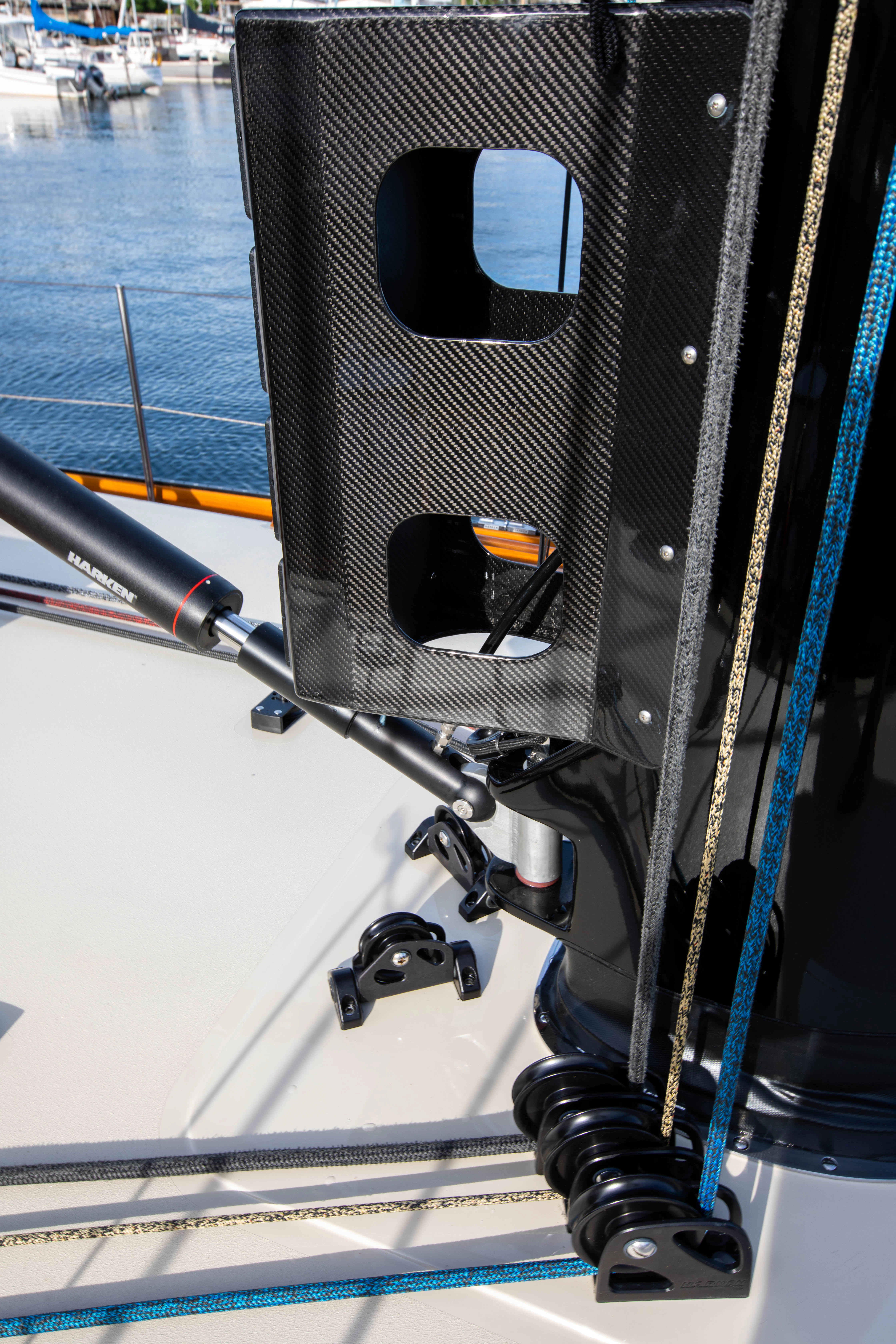a black wheel with a blue and orange frame aboard FALCON Yacht for Sale