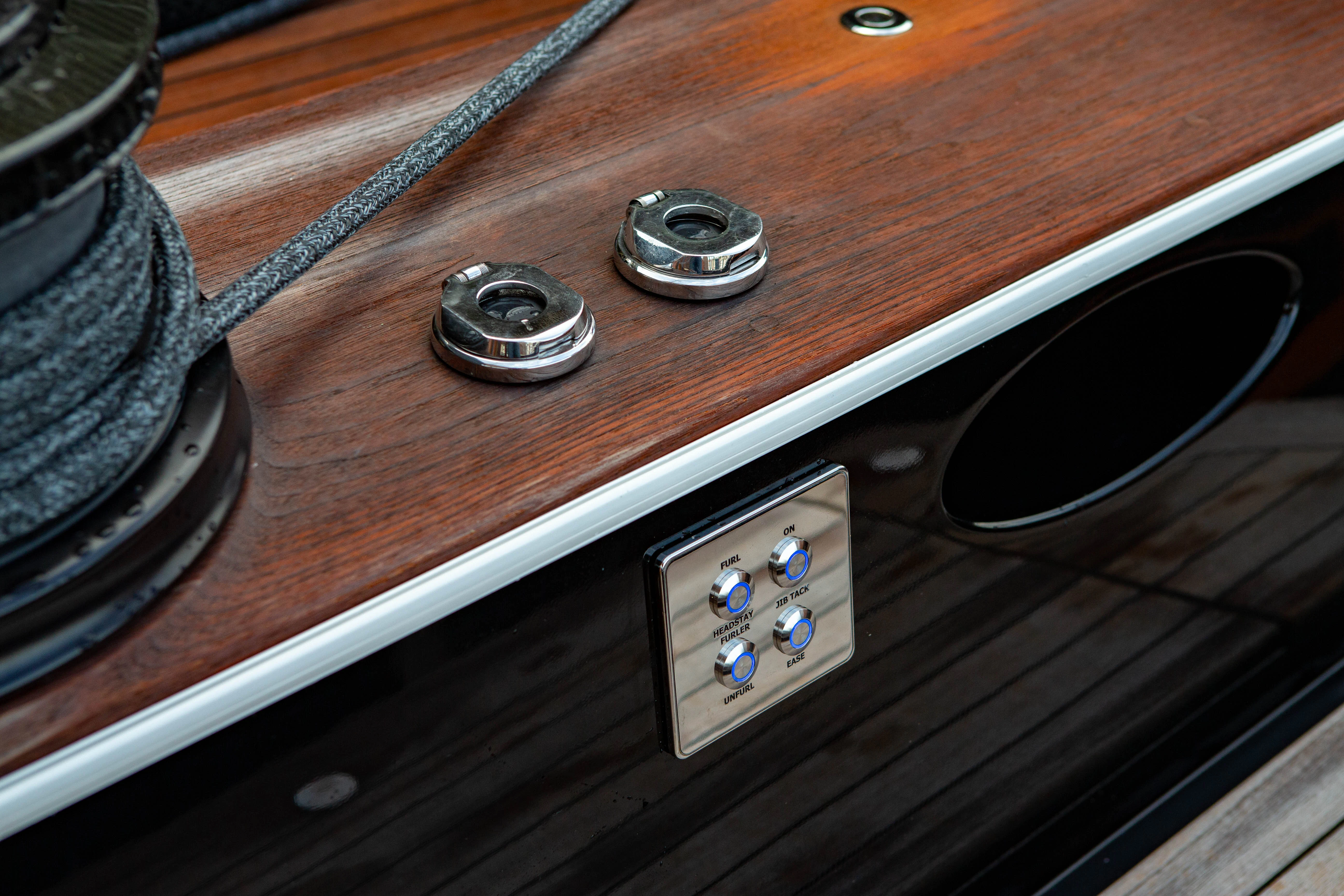 a guitar on a wooden surface aboard FALCON Yacht for Sale