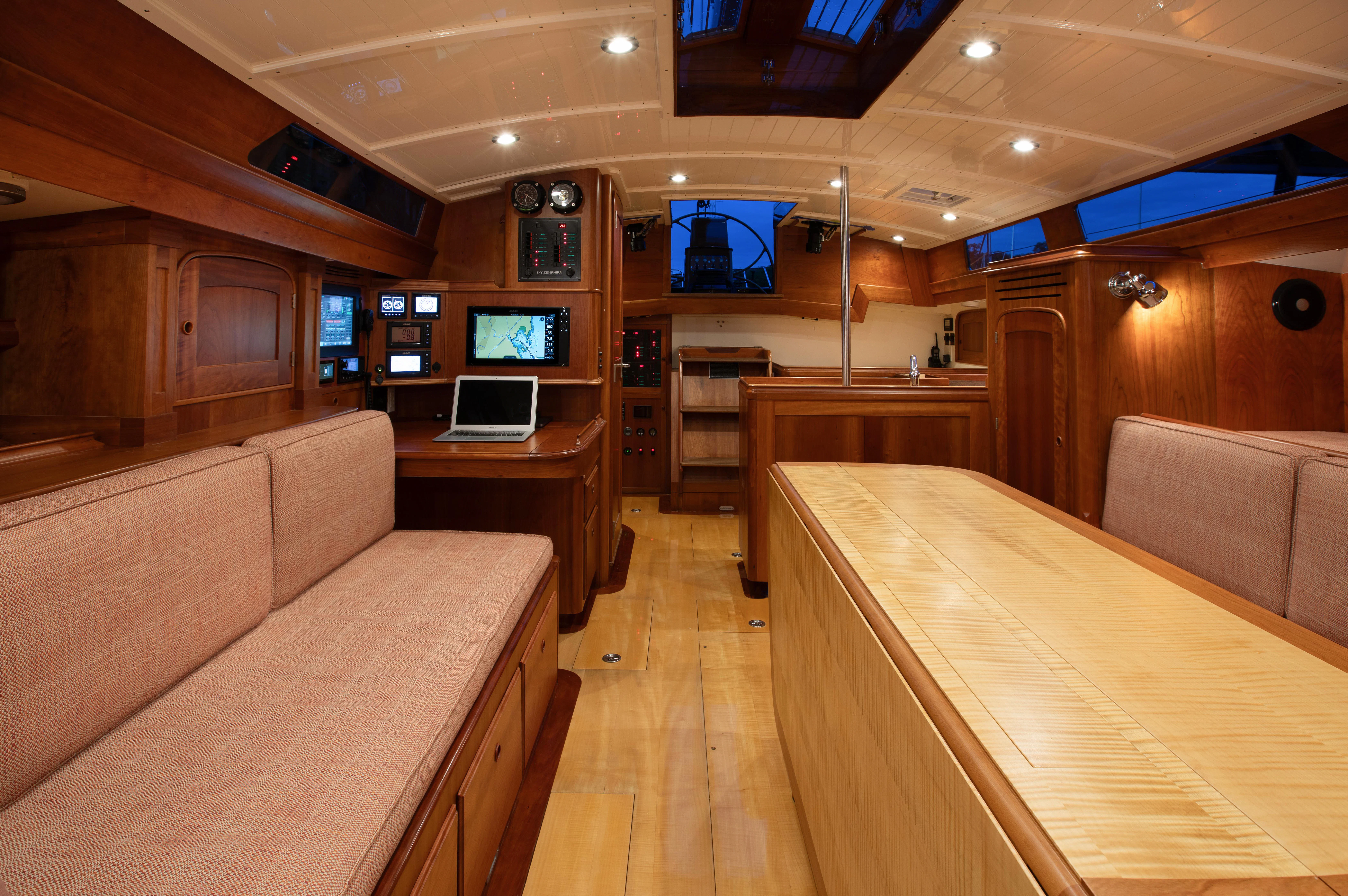a living room with a couch and a tv aboard FALCON Yacht for Sale
