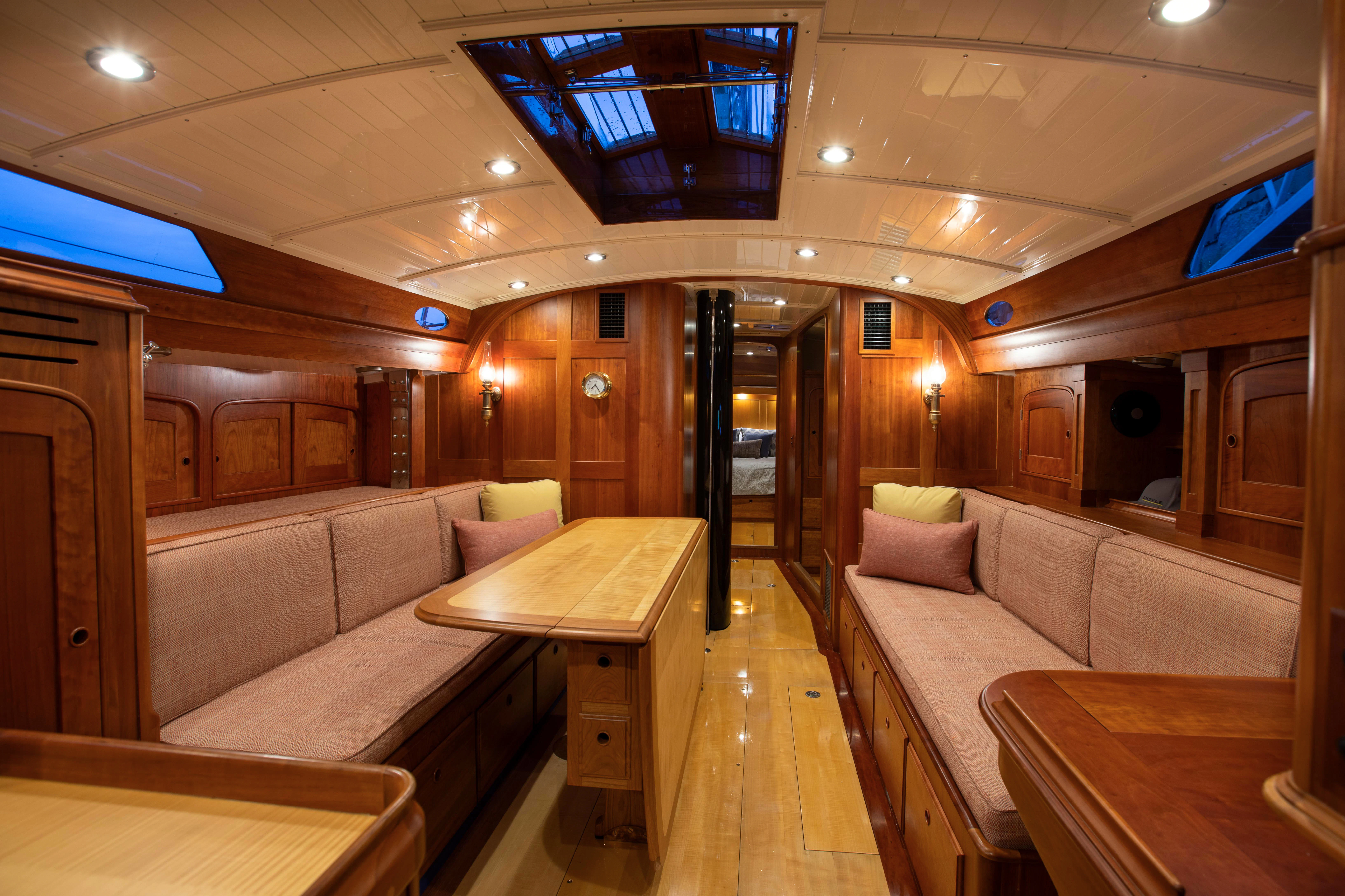 a room with couches and a table aboard FALCON Yacht for Sale