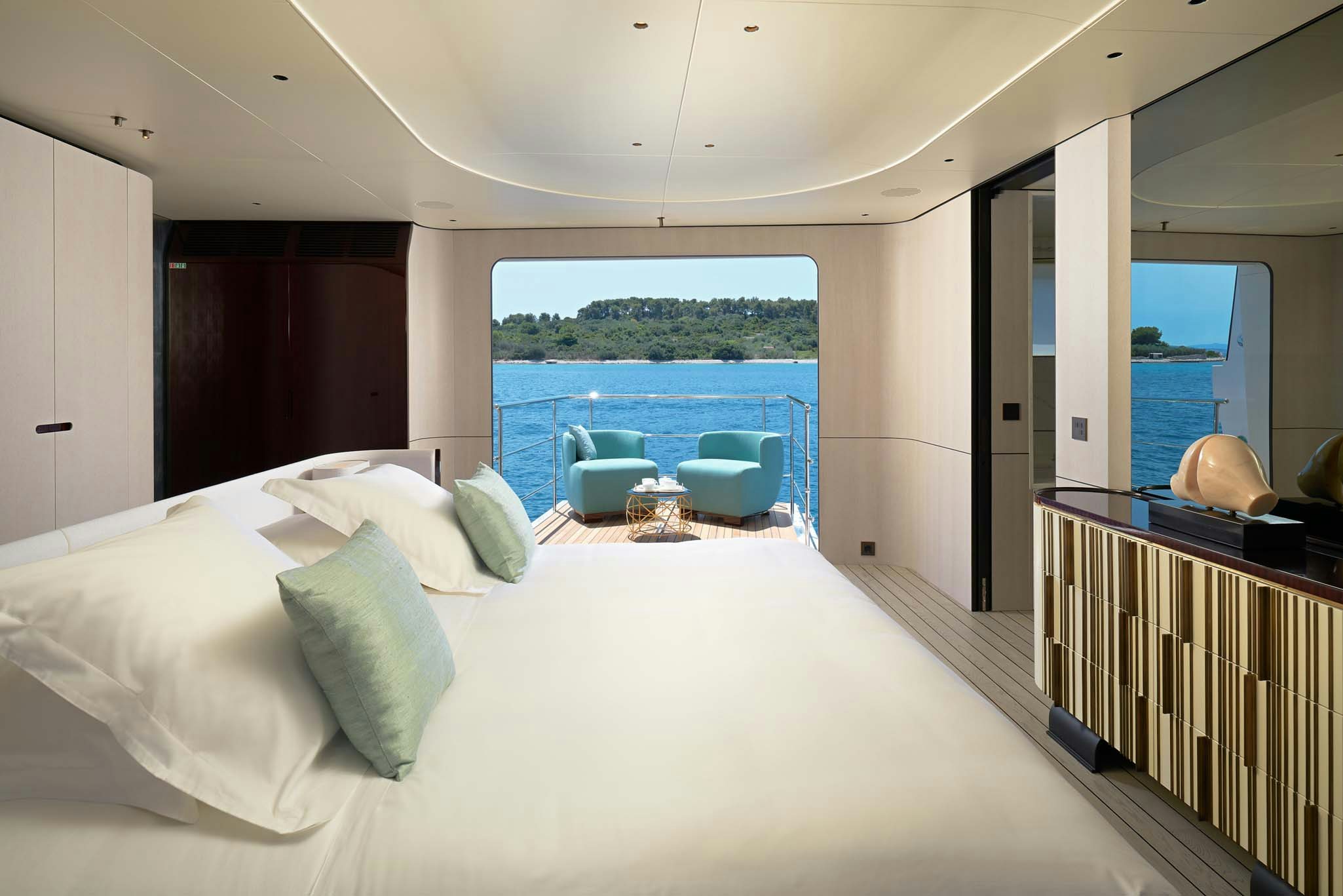a large bed in a room aboard HEED Yacht for Charter